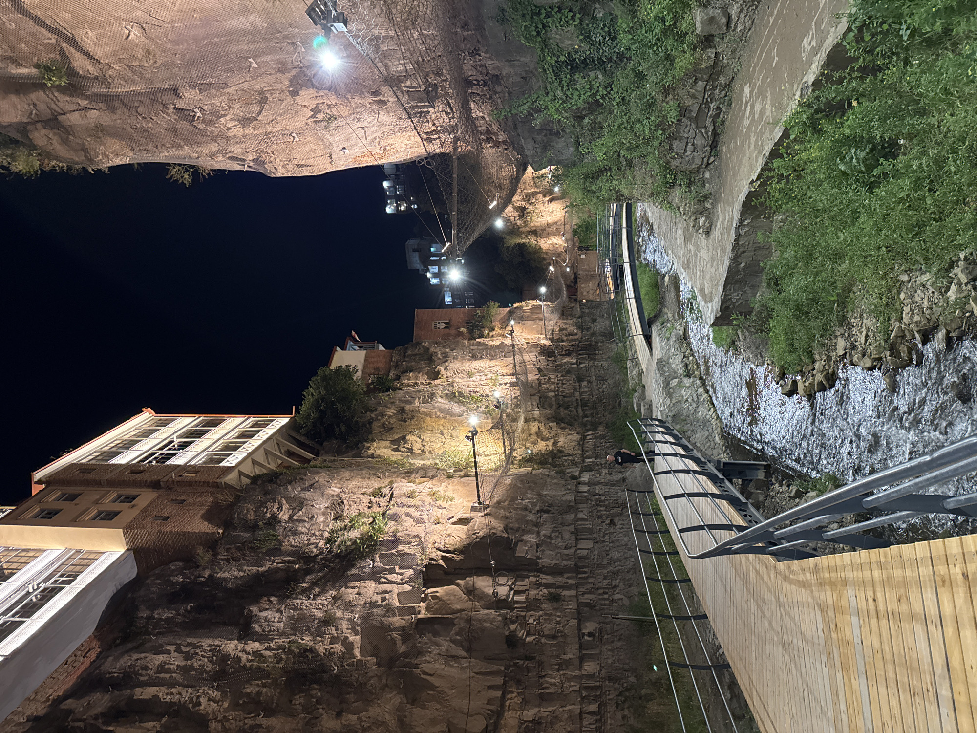 Evening in Tbilisi's Abanotubani gorge, waterfalls and string lights