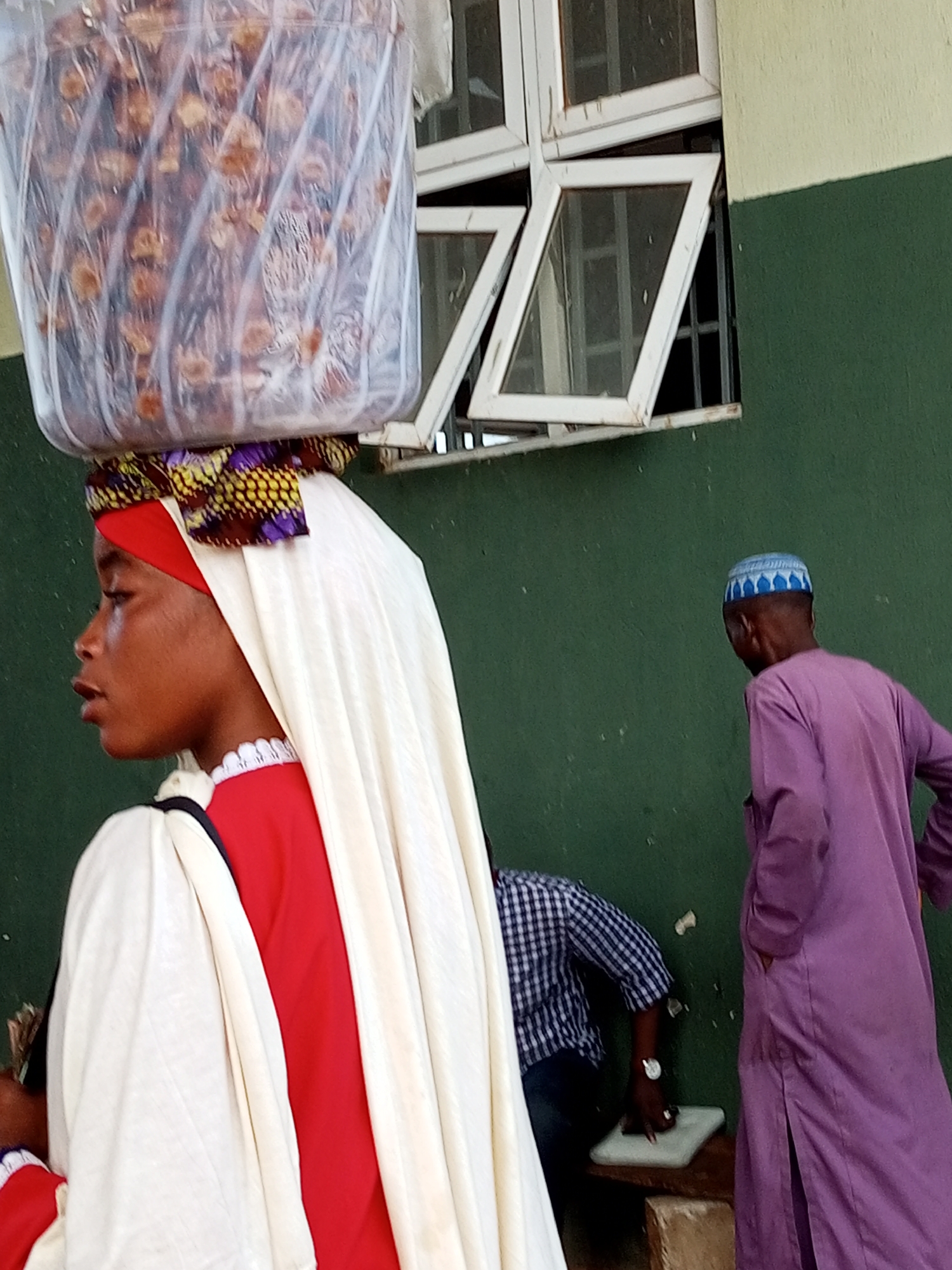 Street food vendors and buyers gather at an outdoor market