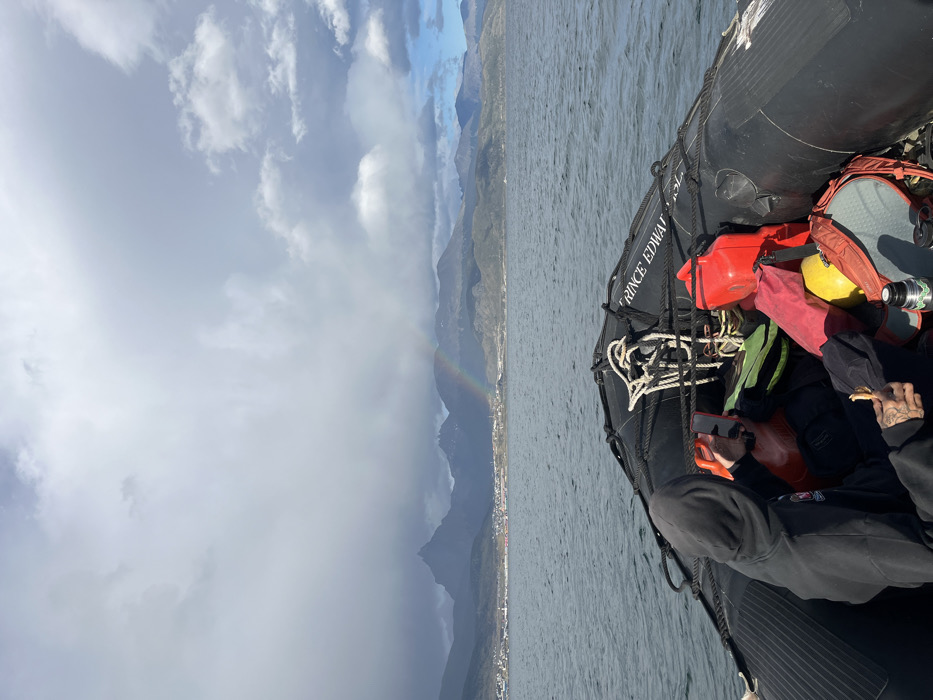 Rainbow appears over Ushuaia during boat tour excursion