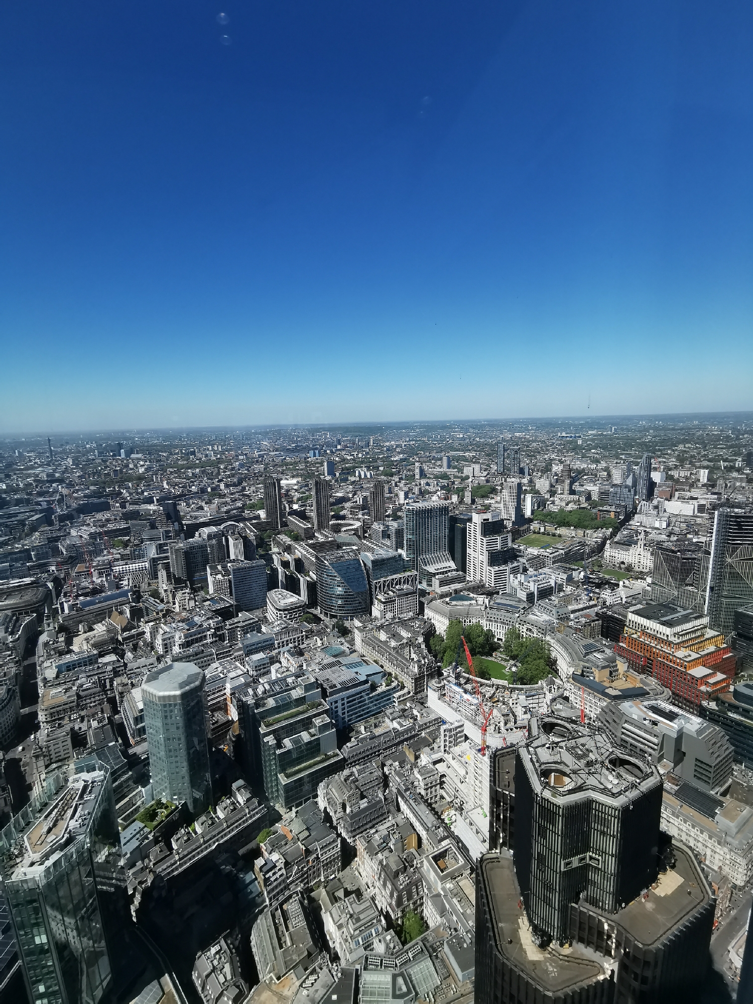 Aerial view captures London cityscape under clear skies