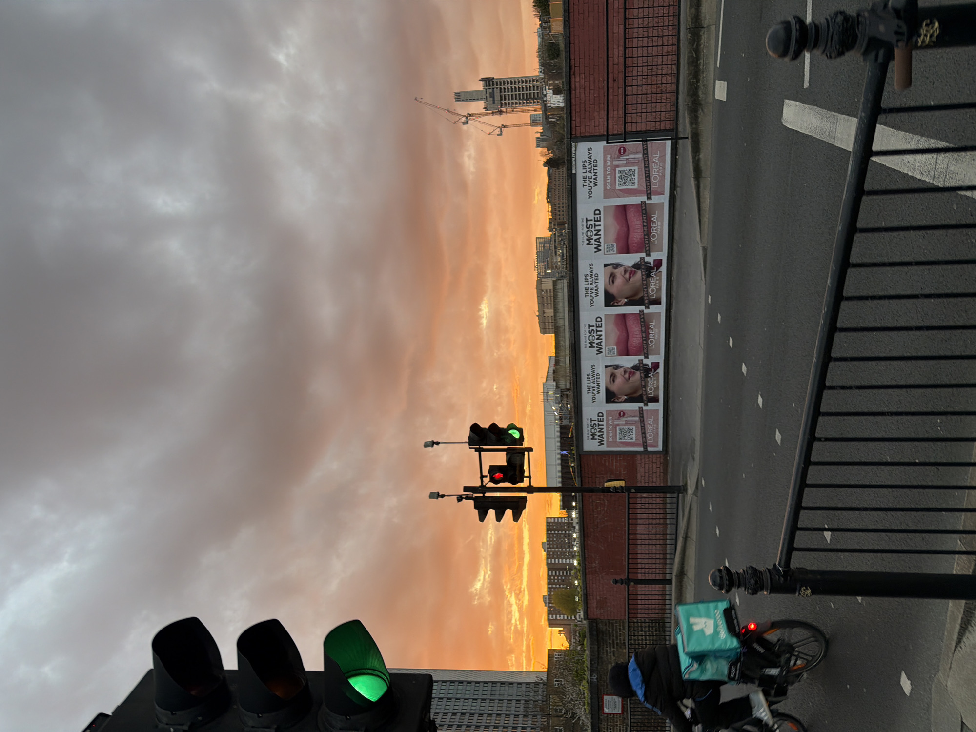 London street captured under dramatic orange sunset skies
