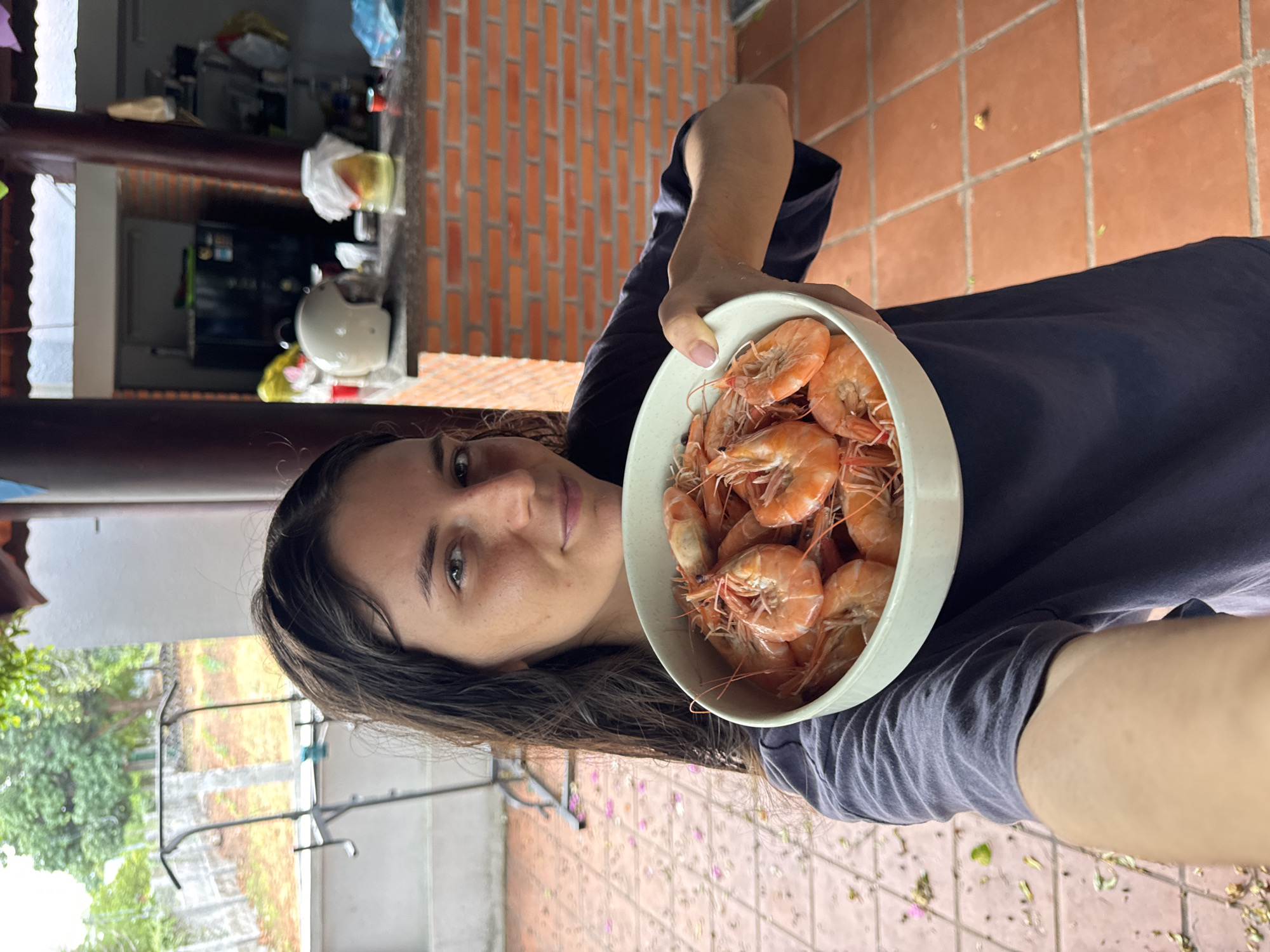 Woman with shrimp bowls, kitten in blanket captured in Mũi Né