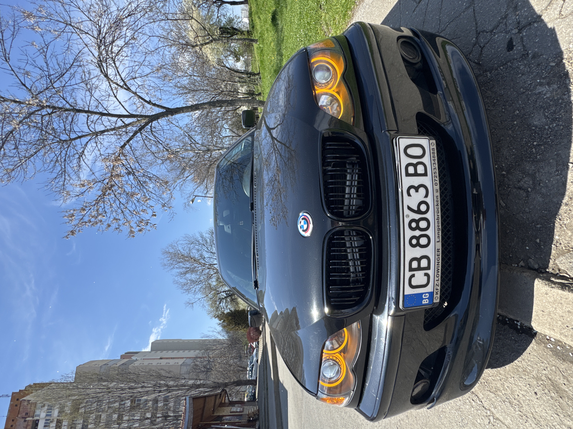 Black BMW parked near CreditX building in Sofia