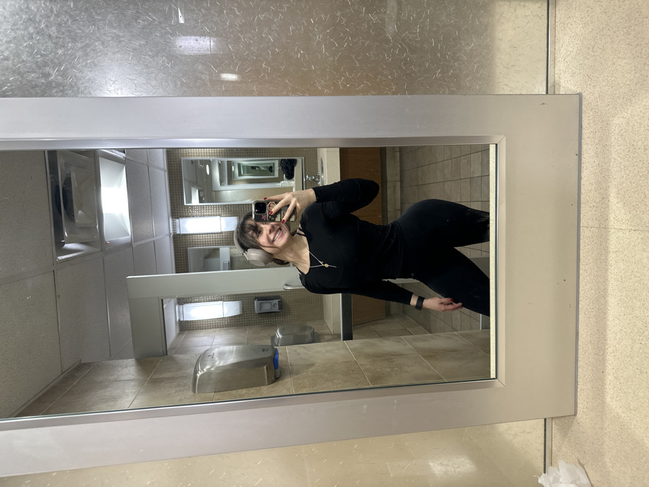 Woman takes selfie in Santa Monica public restroom