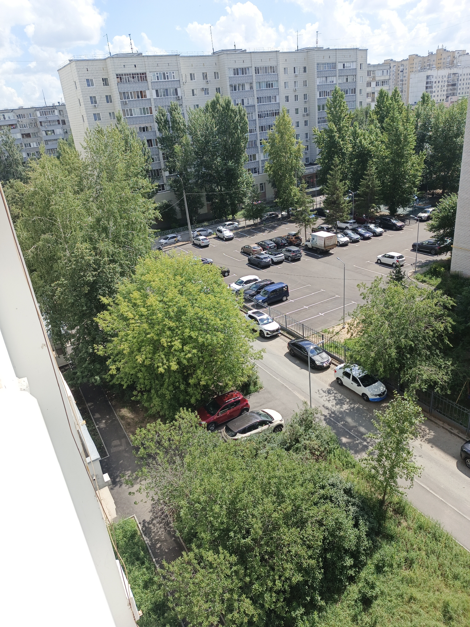 Summer morning inside and outside a Kazan apartment neighborhood