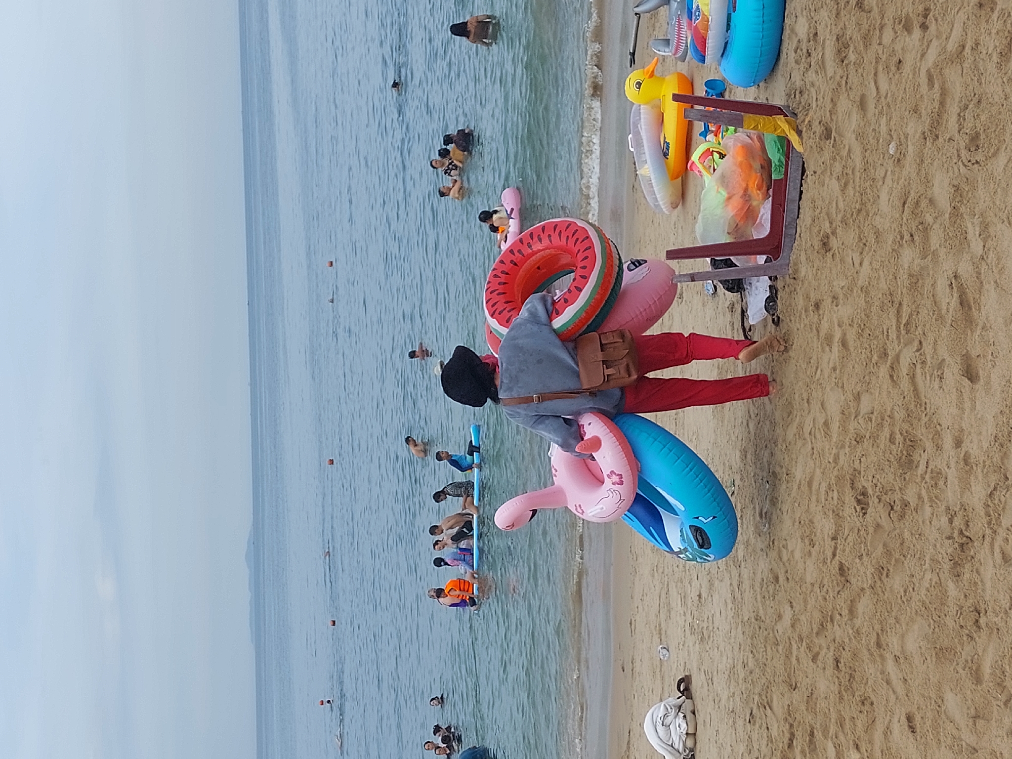 Nha Trang beach morning: rentals, paddleboards, and busy streets