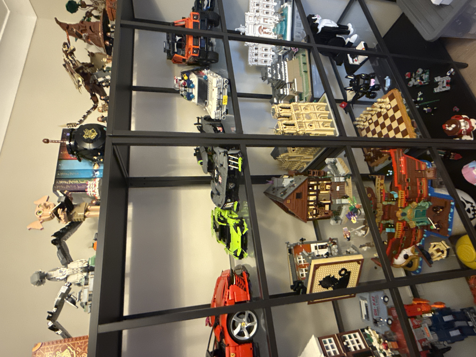 Lego collection on black metal shelves, Newcastle-under-Lyme