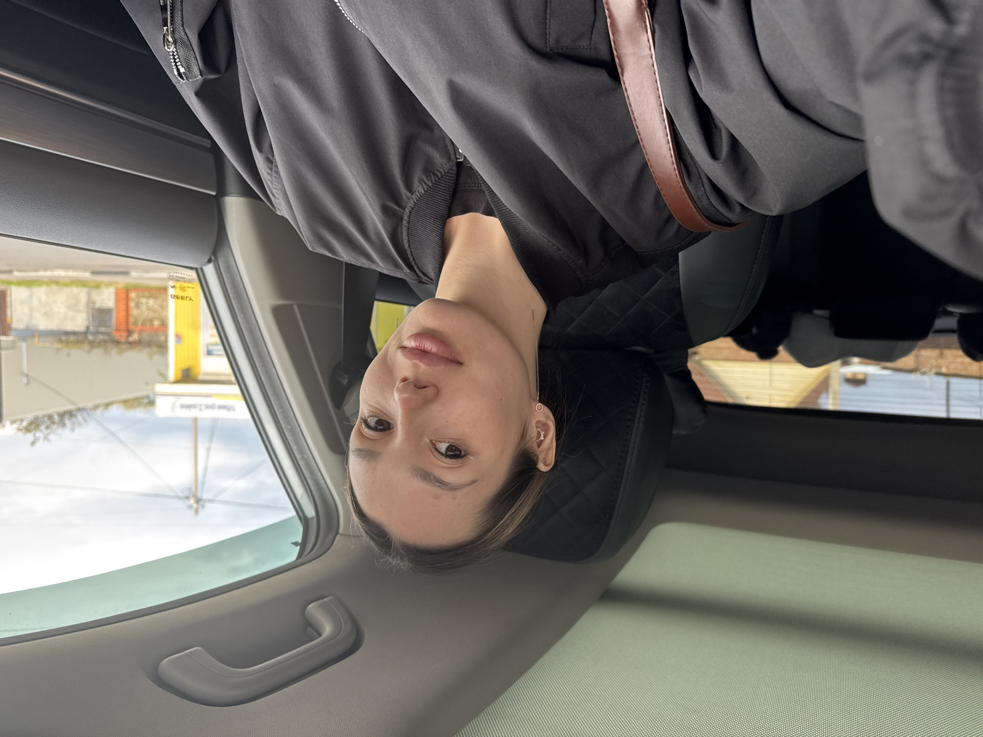 Woman photographed with car, #YourRide promotional content captured