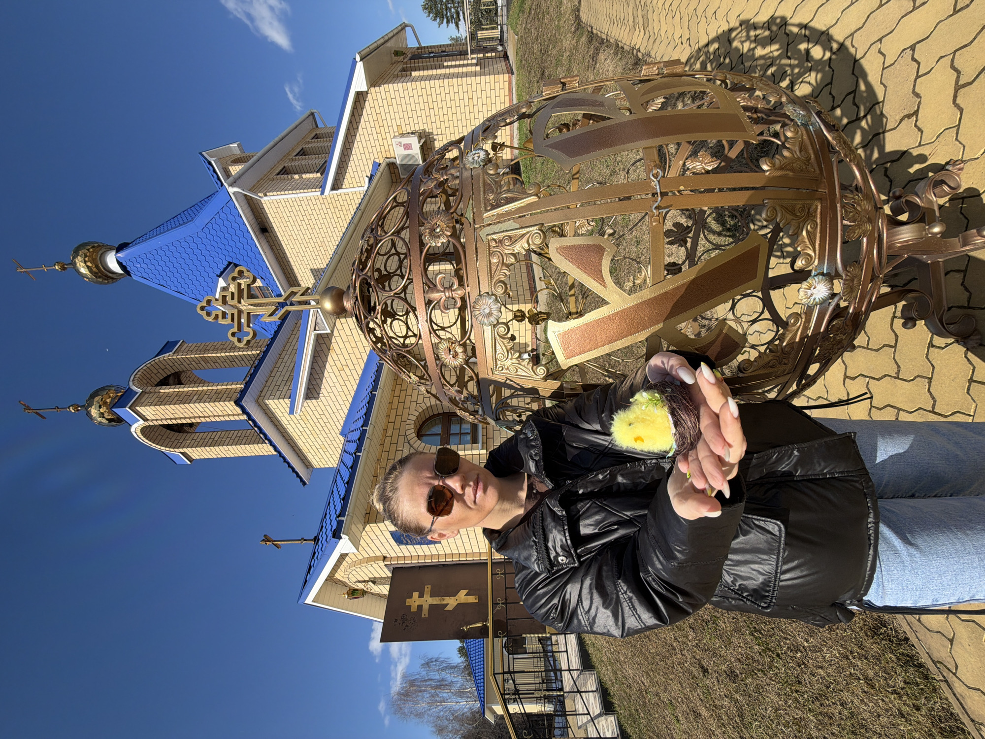 Woman visits Orthodox churches with Easter items in Chaikovsky