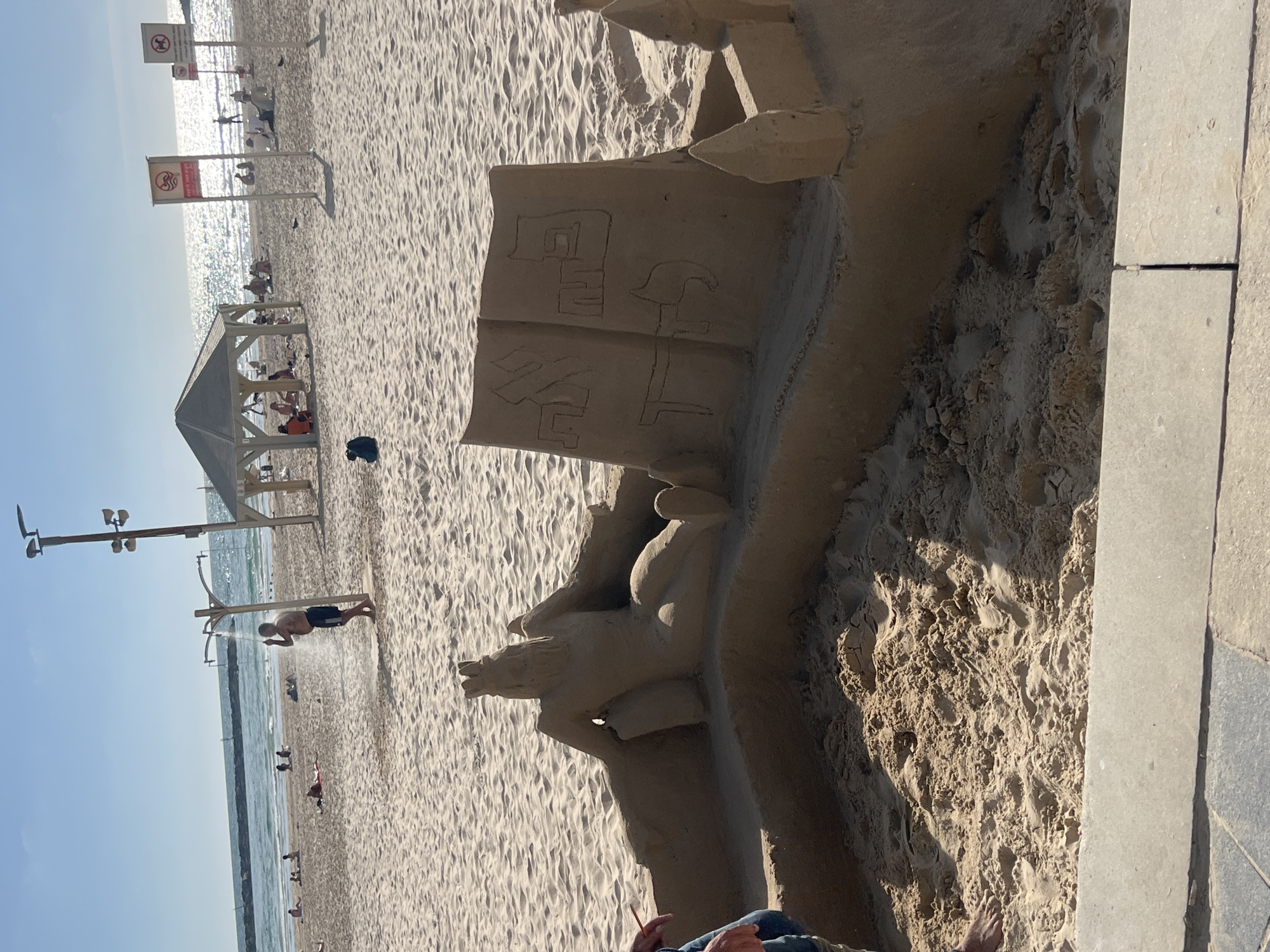 Tel Aviv beach scenes: sand sculptures, volleyball, casual afternoon