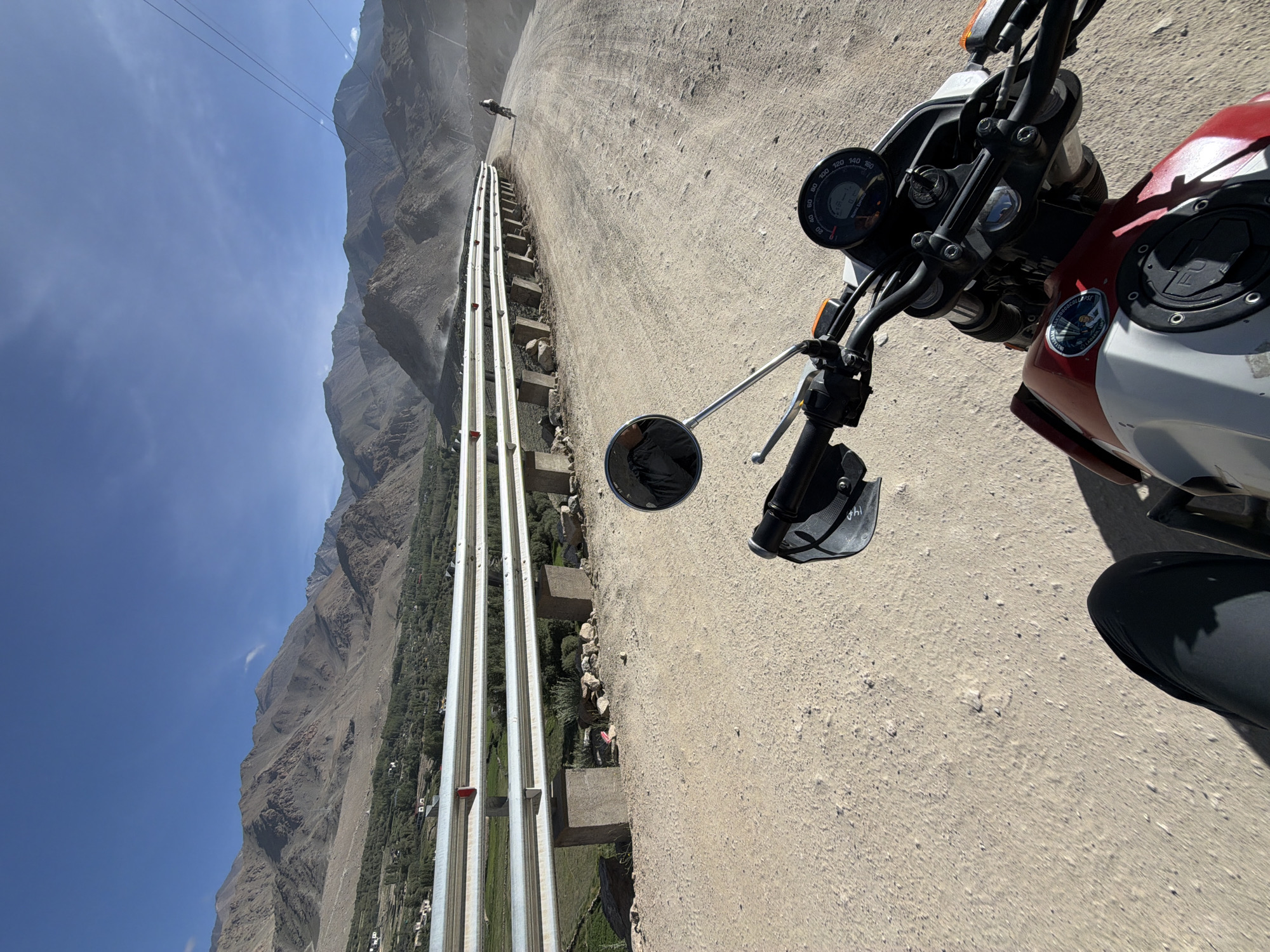 Riding a dusty mountain road through Leh, India