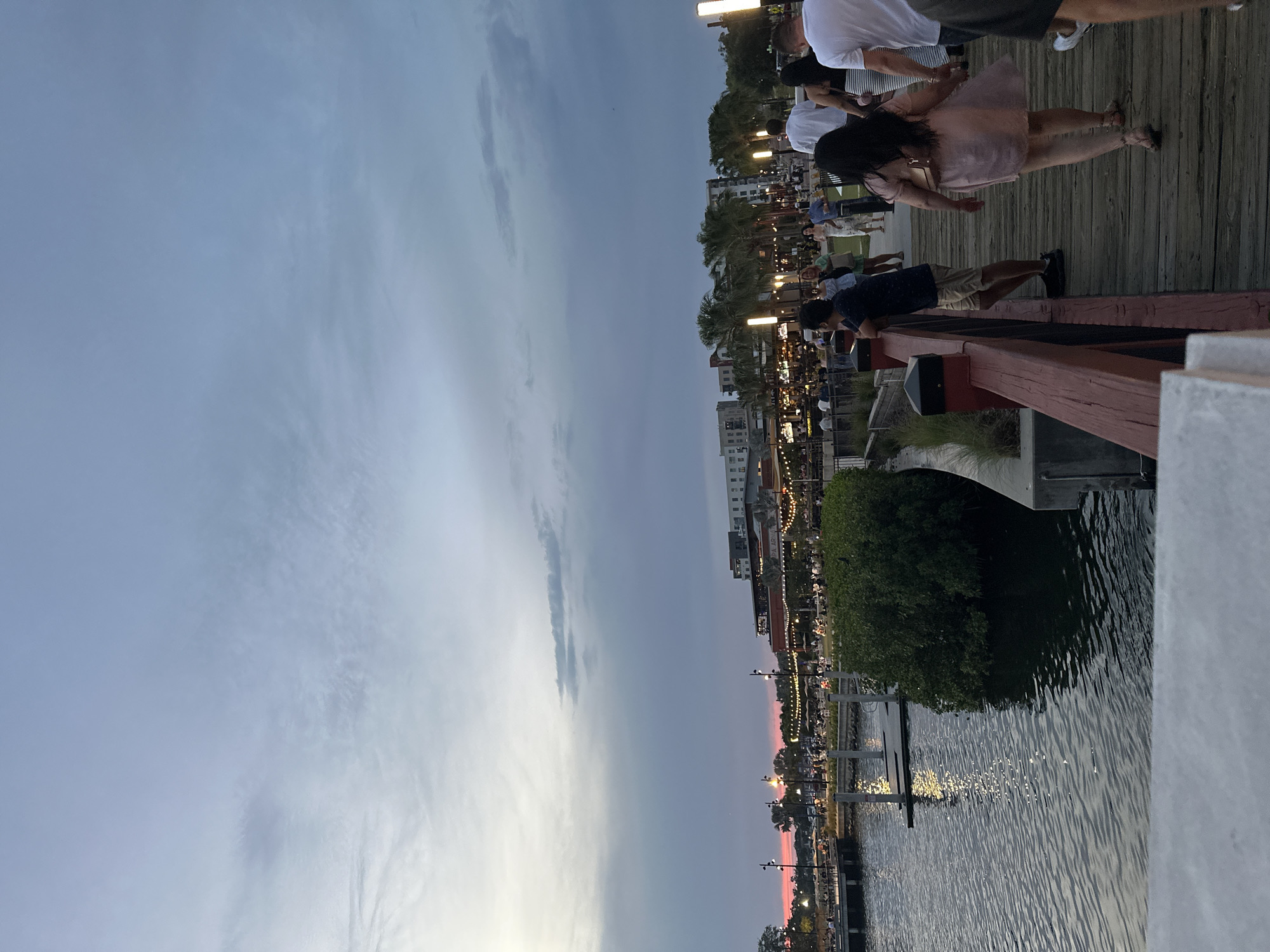 Evening gathering on Tampa waterfront boardwalk draws small crowd
