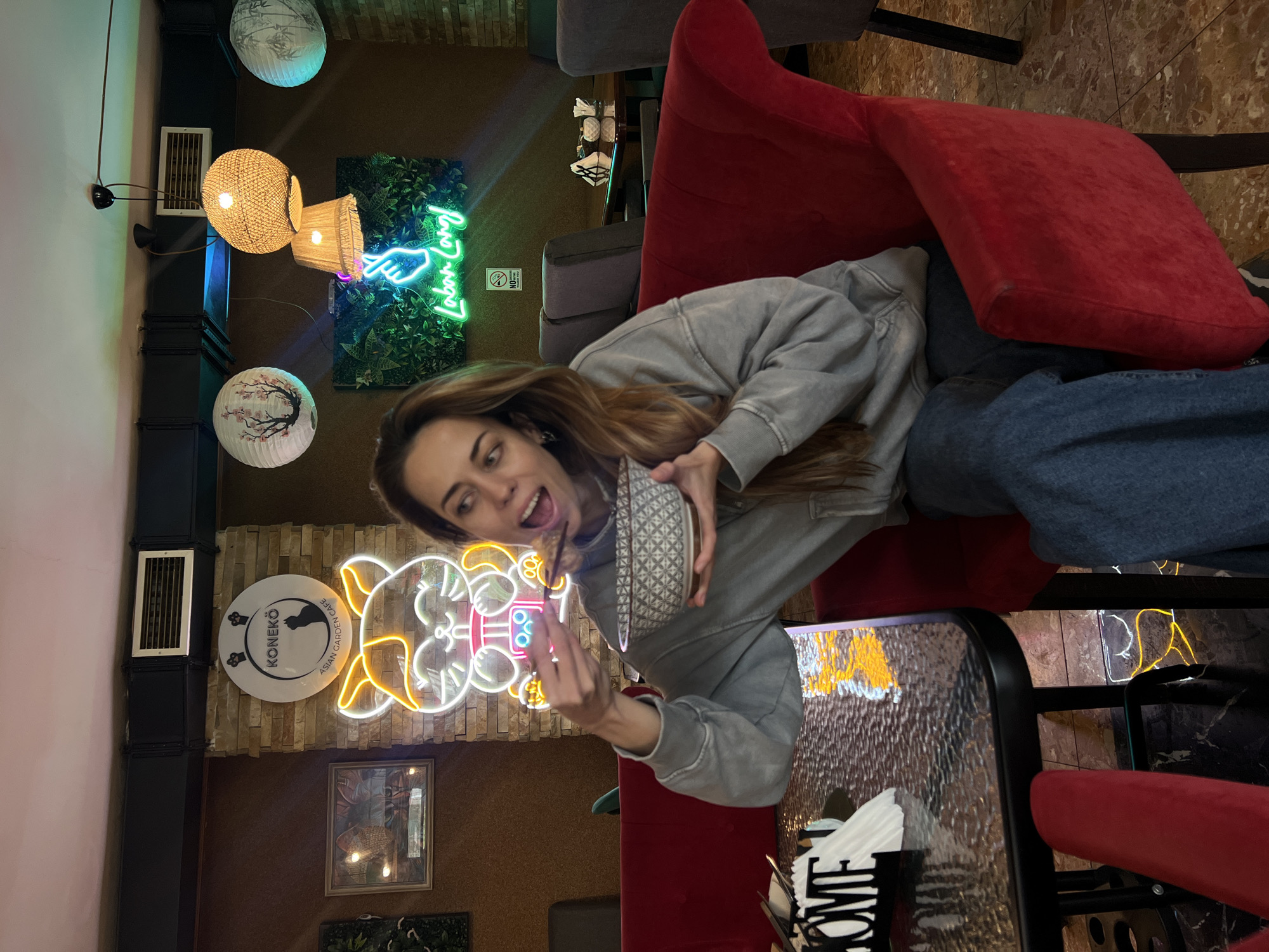 Woman enjoys ramen lunch at Japanese cafe in Podgorica