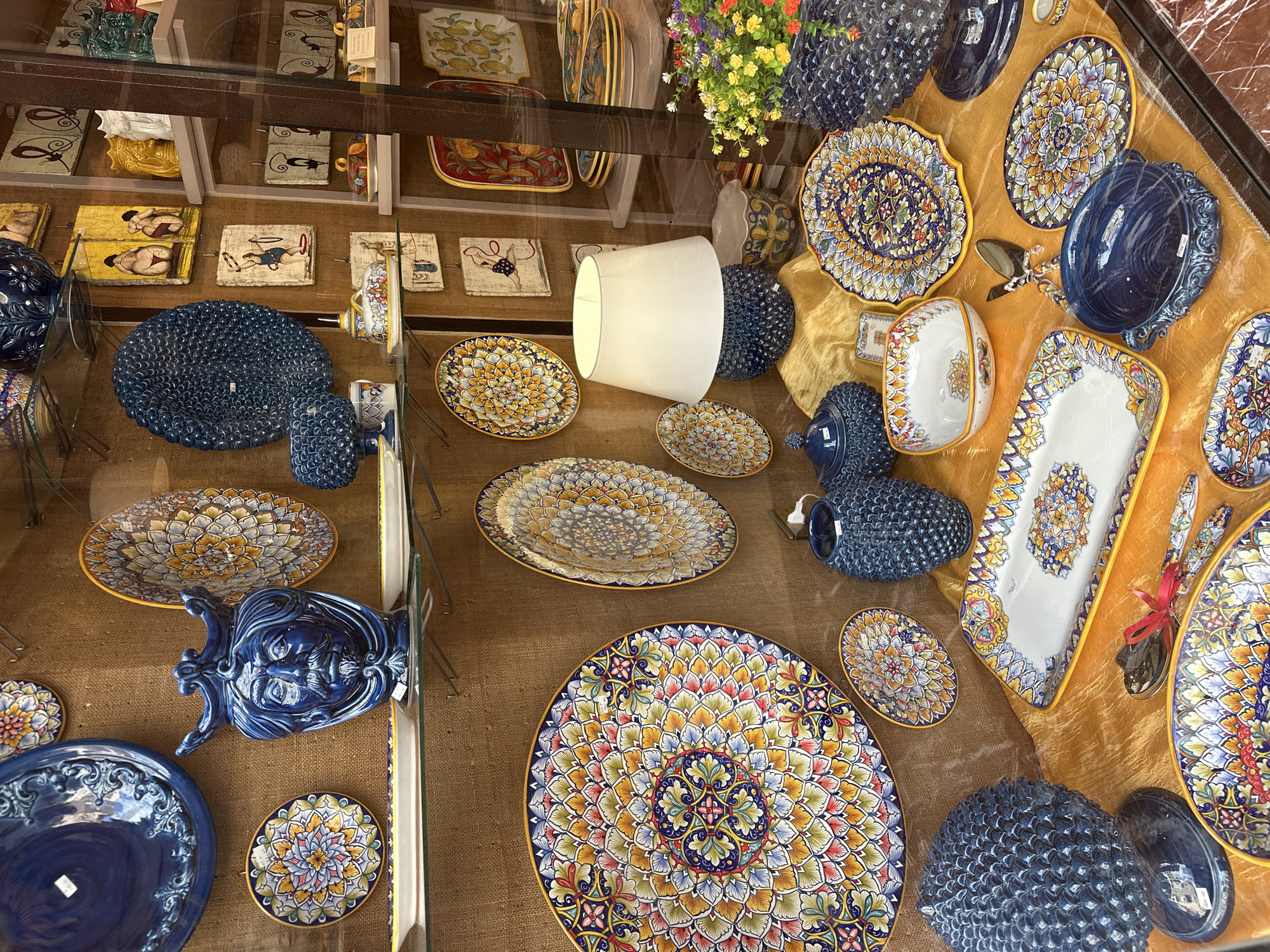 Ceramic pottery display observed in Taormina shop window