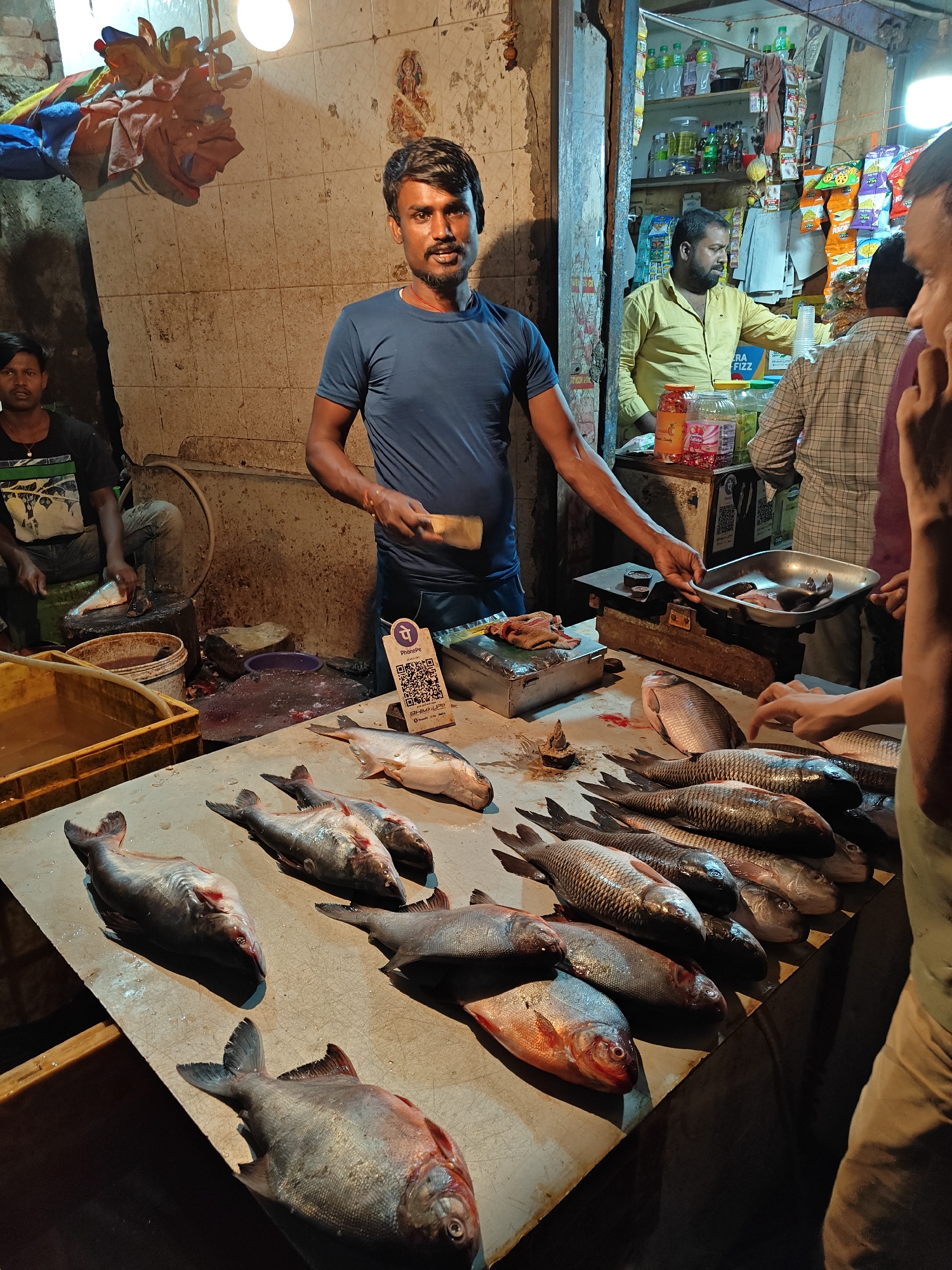 Mumbai street vendors conduct evening business across city markets