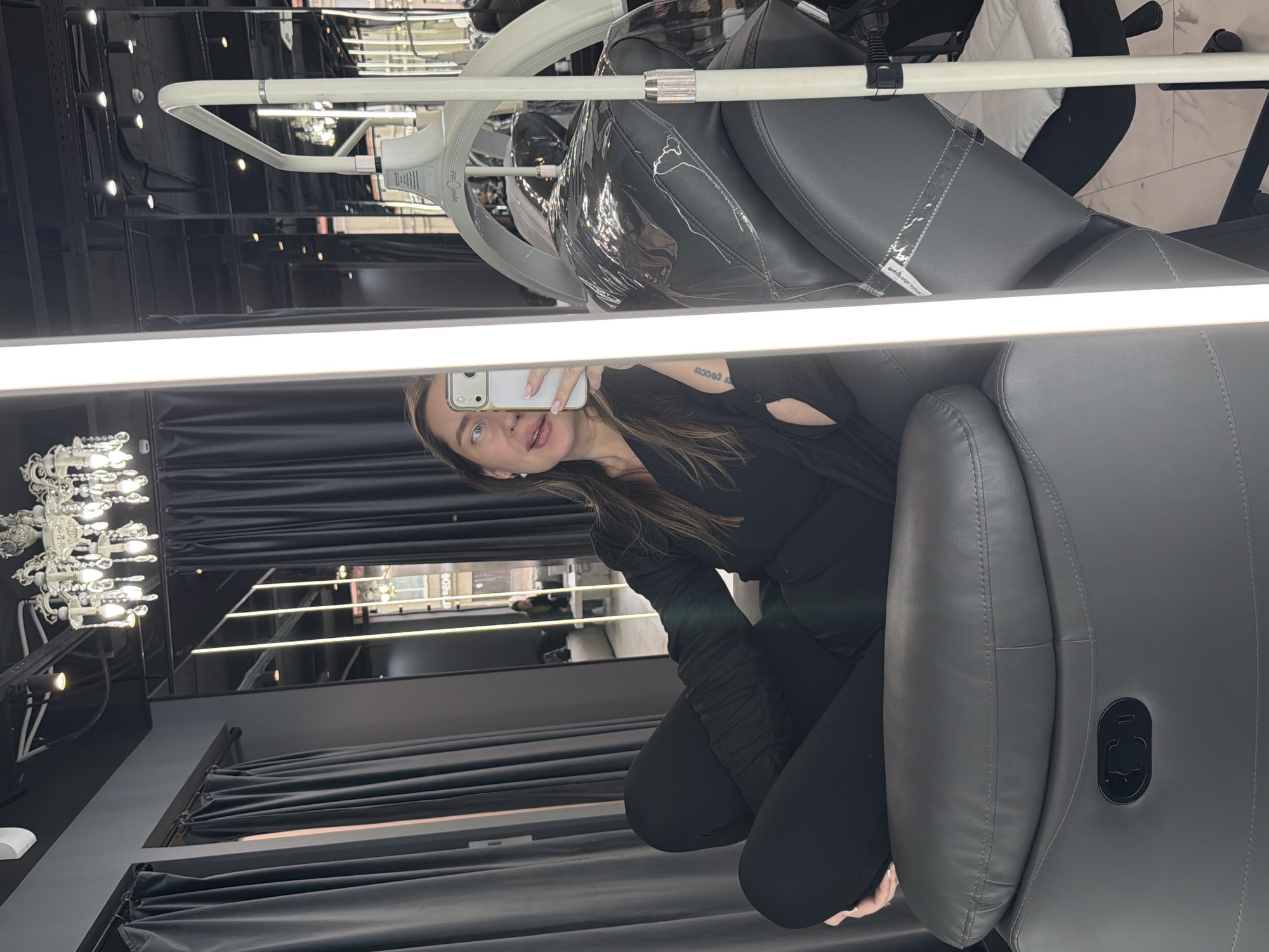 Woman takes selfie in upscale Moscow interior