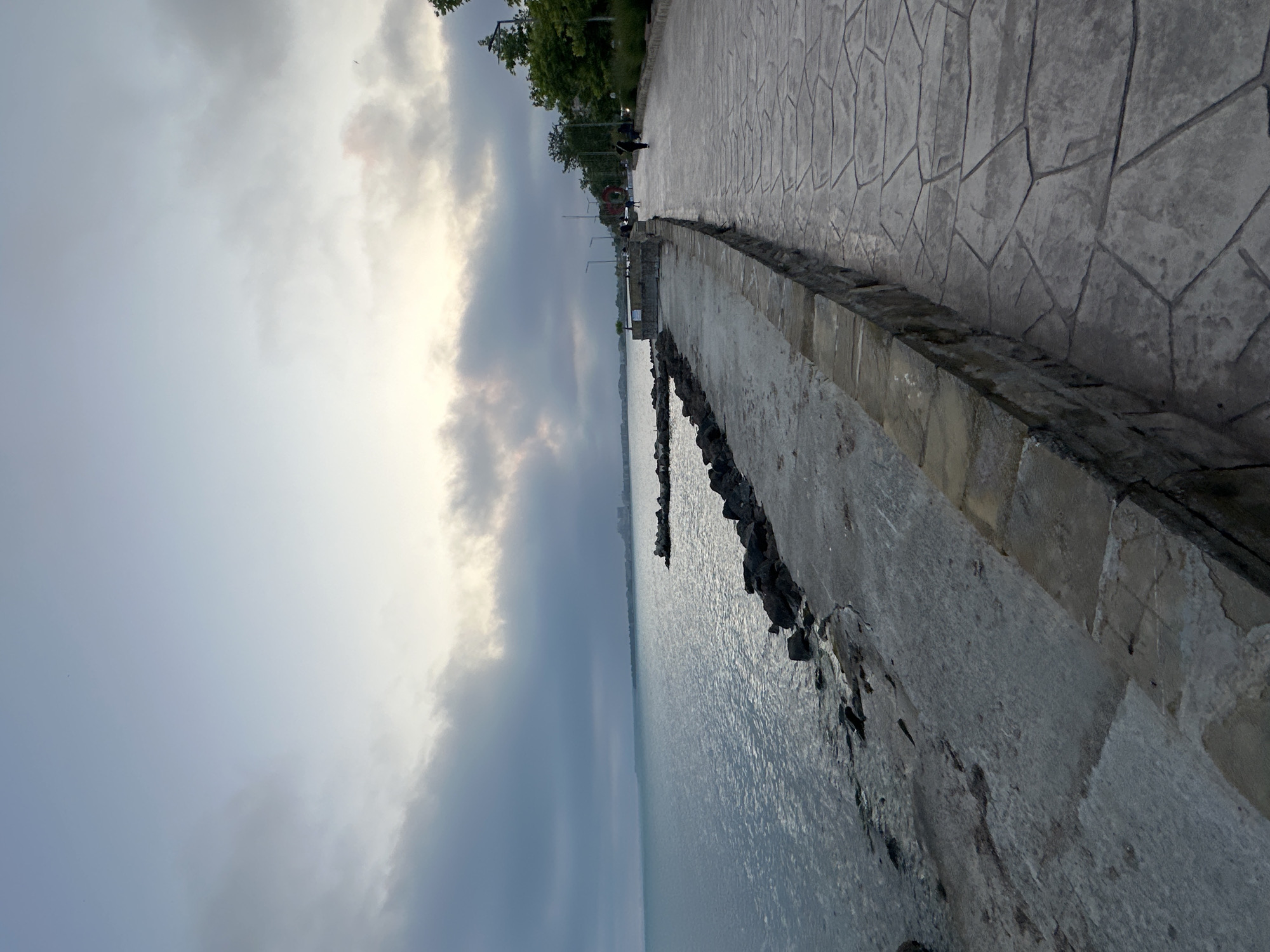 Overcast evening captured along coastal promenade walkway
