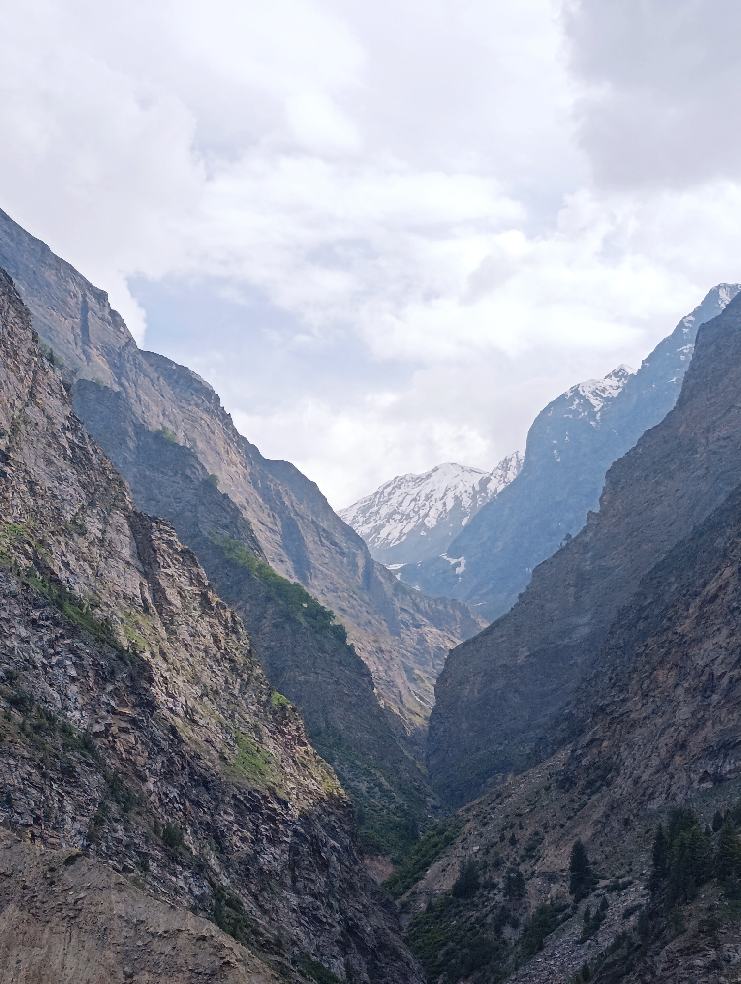 Kirting valley's river gorges, terraced slopes, and mountain scenery