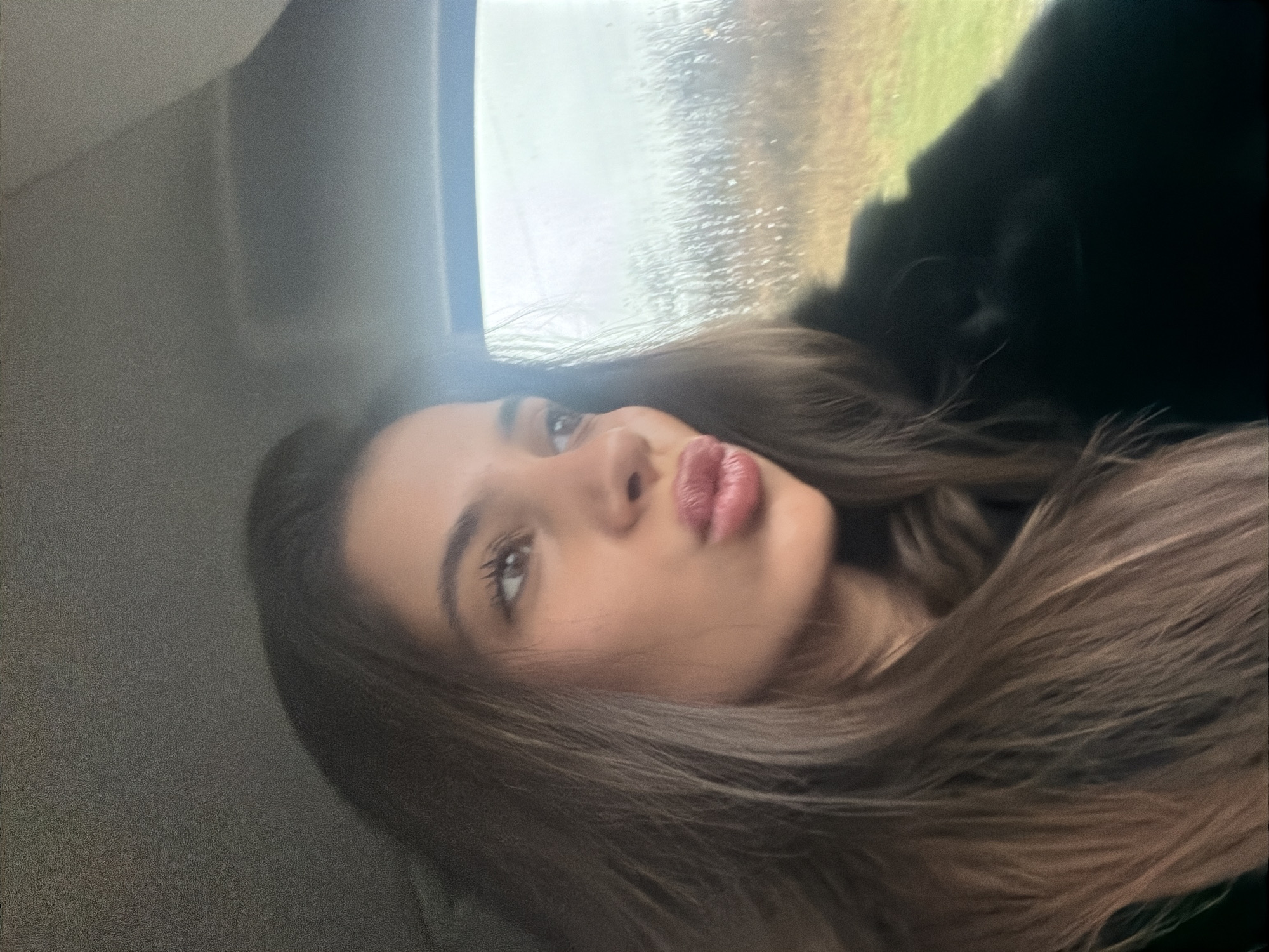Woman makes pouty face while in vehicle in Bulgaria