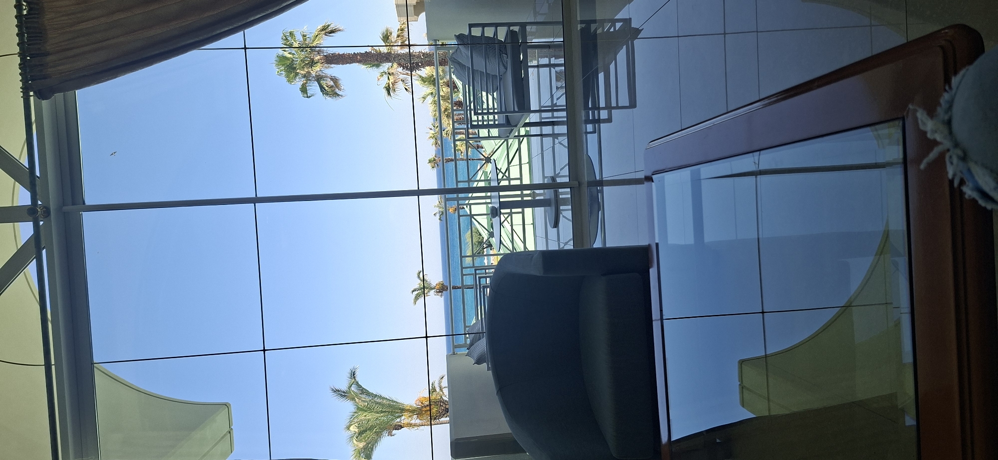 Relaxed afternoon in a Rhodes hotel lobby overlooking the sea