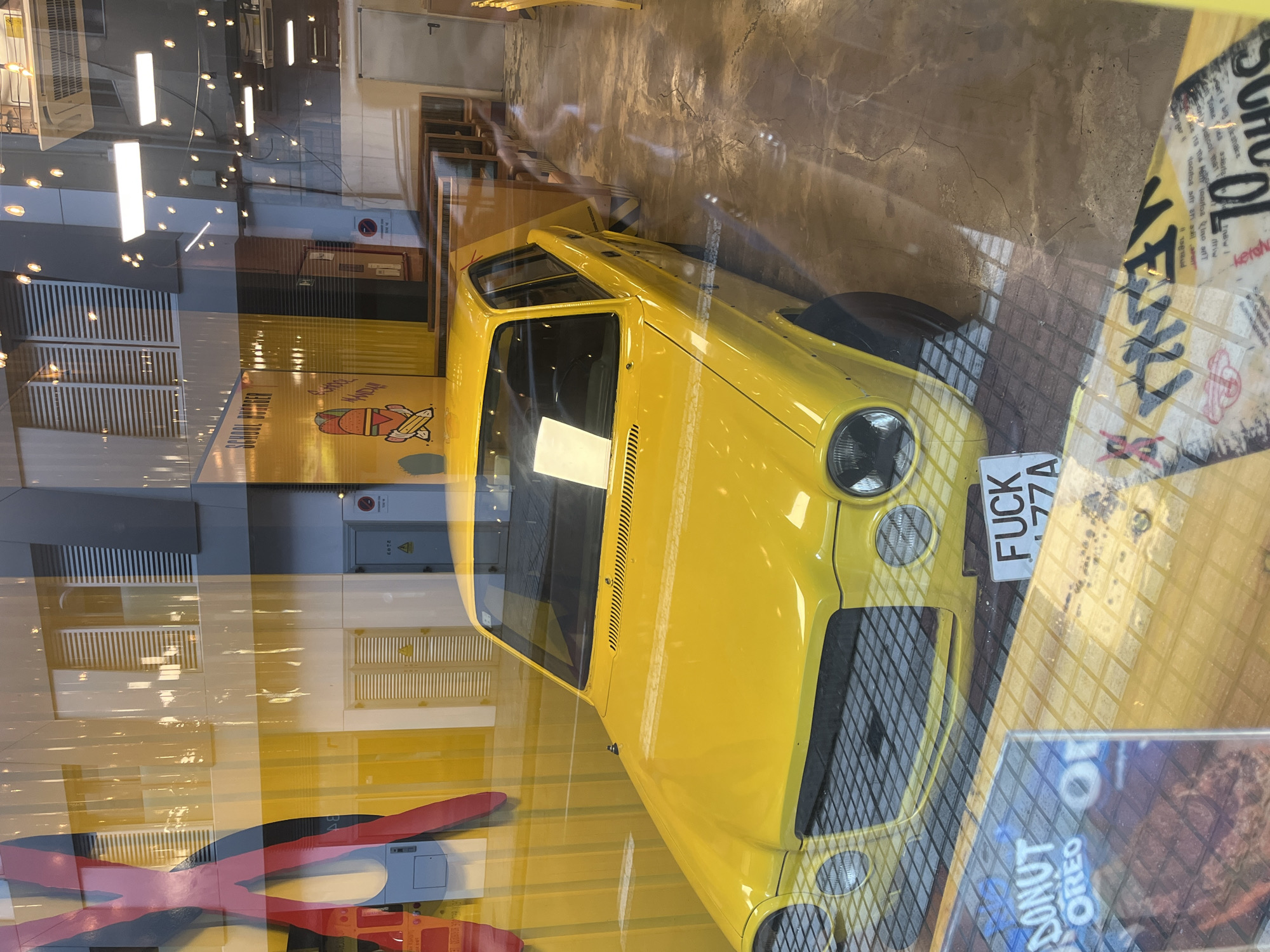 Vintage yellow car spotted in Las Palmas restaurant display