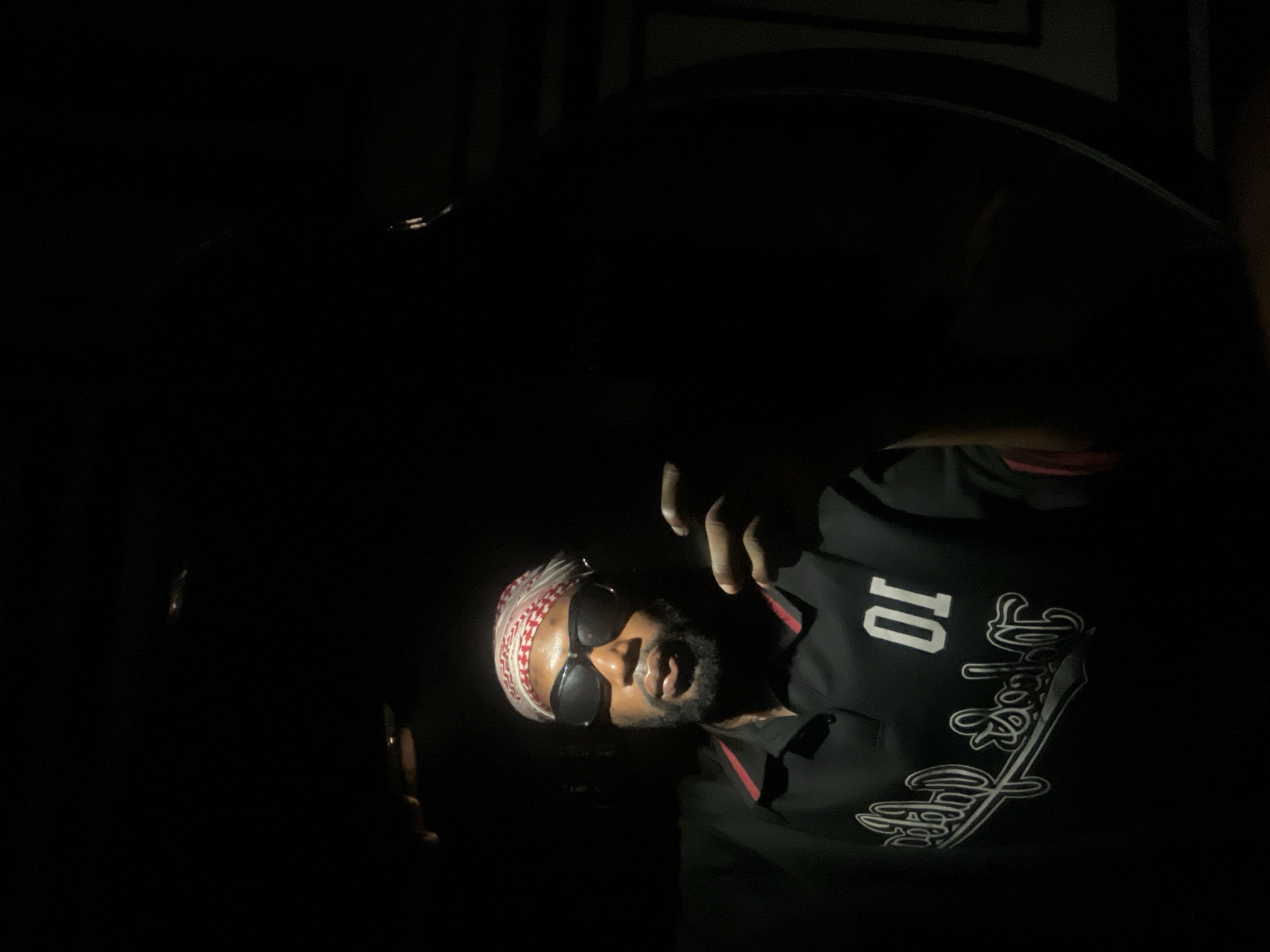 Man takes selfies in traditional headwear in Lokoja