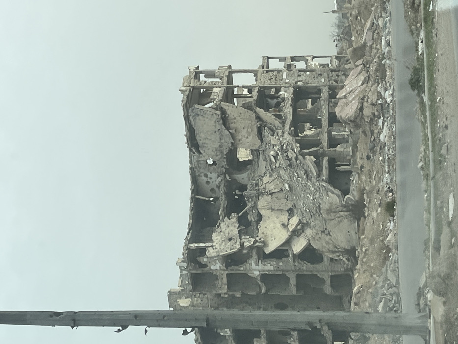 Vehicle journey documents extensive war damage in Damascus suburb