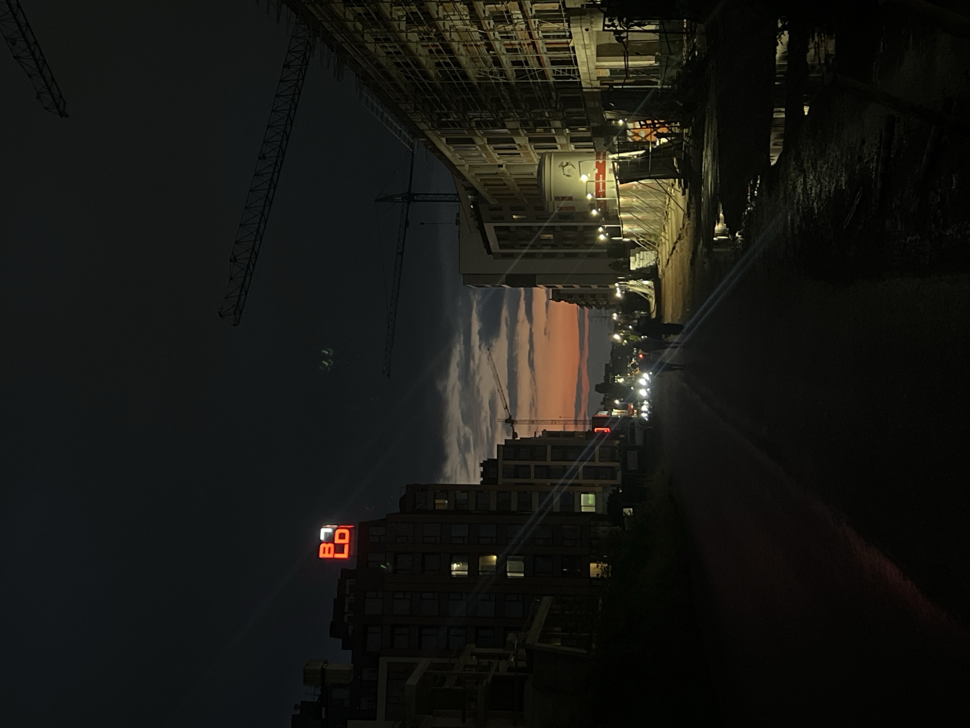 Sofia evening captures construction cranes and bilingual fortune message
