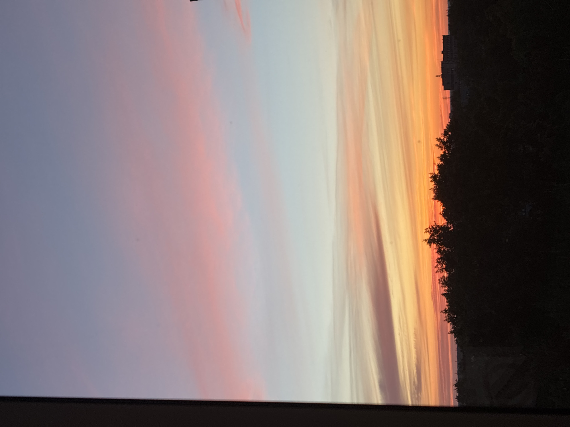 Vibrant sunset illuminates urban skyline in evening display