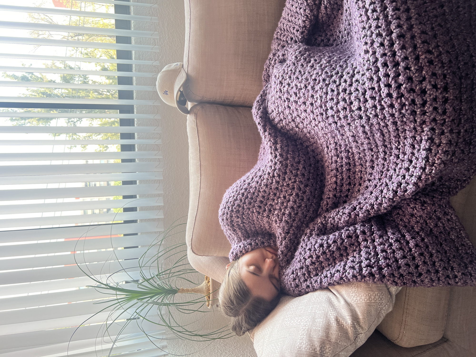 Woman rests on sofa in Mexico City home