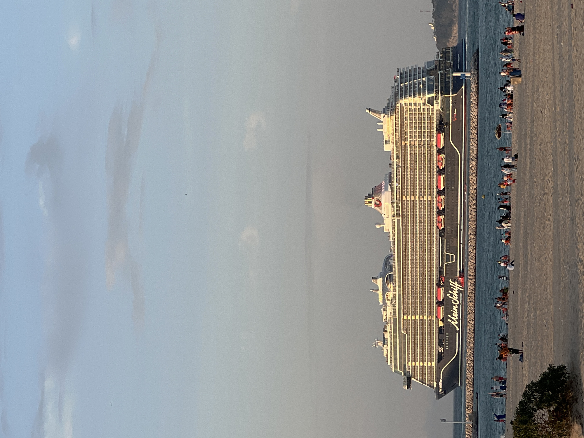 Sunset at Tangier marina as a cruise ship passes by