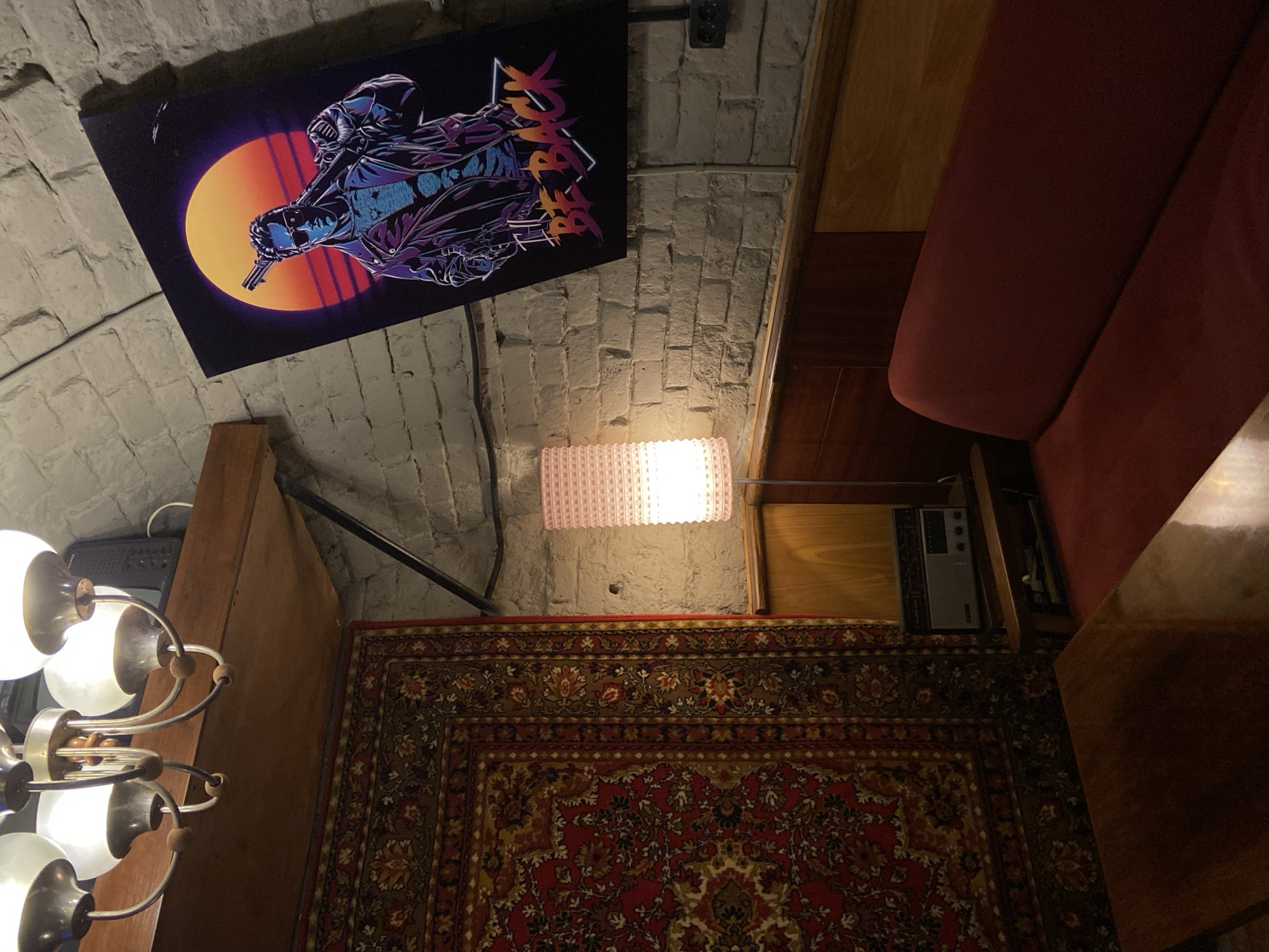Indoor space displays vintage-modern mix with sunset character poster
