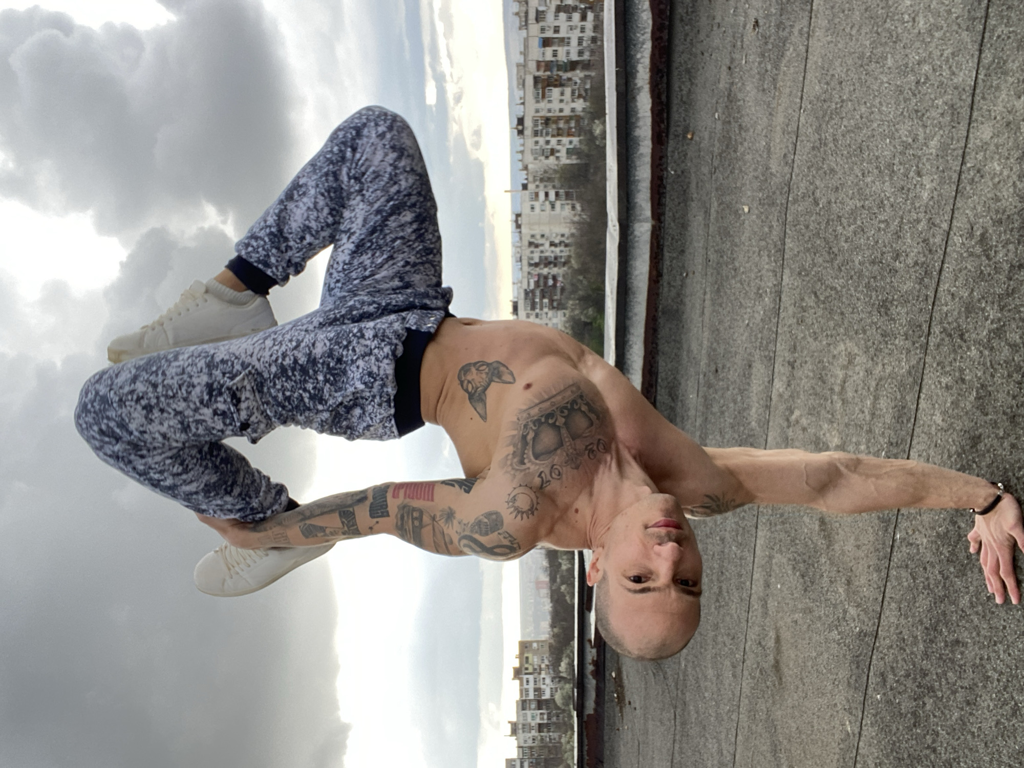 Man performs rooftop workout amid dramatic skies in Pleven