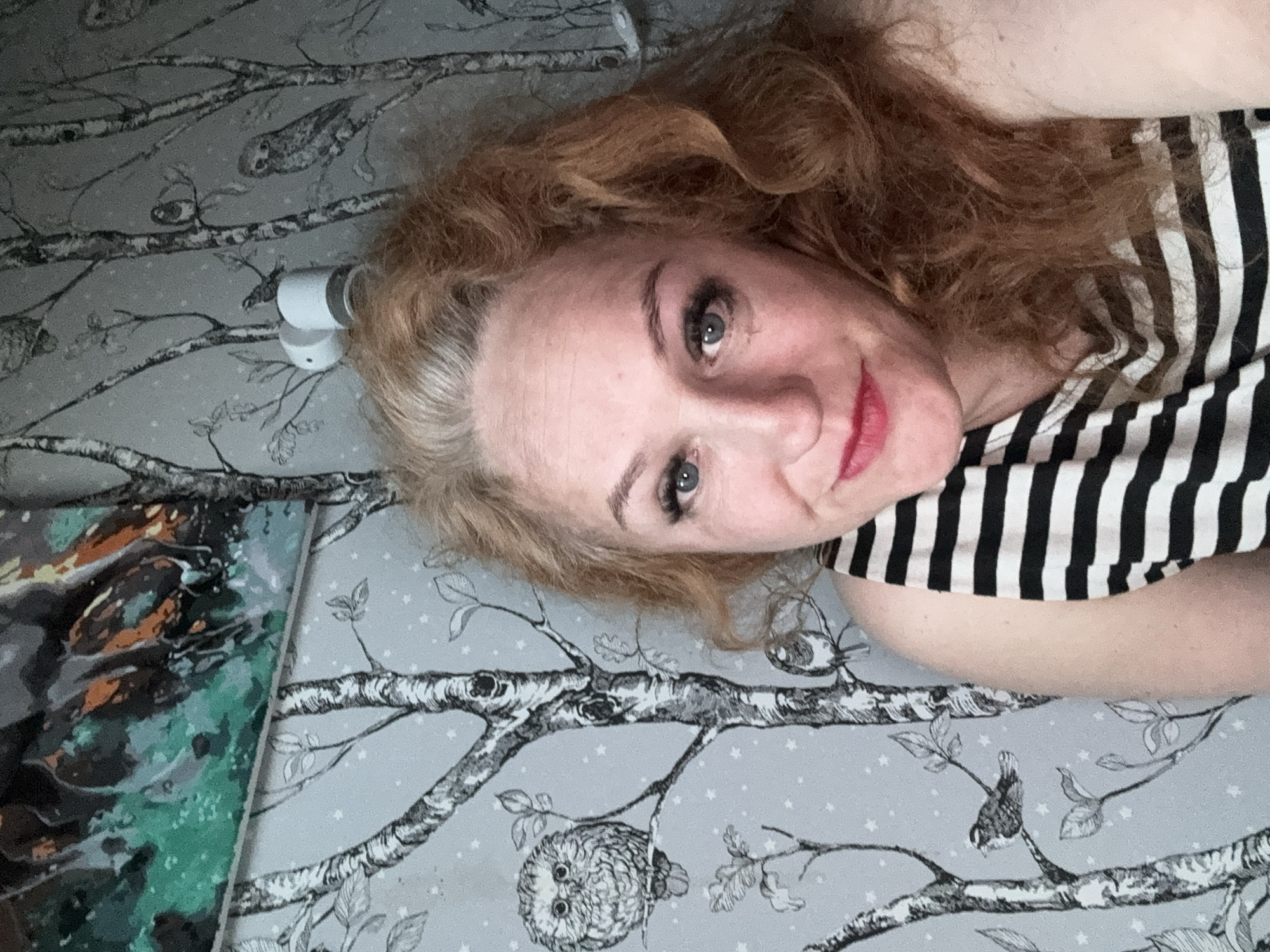 Woman takes relaxed indoor selfies in Chaikovsky, Russia