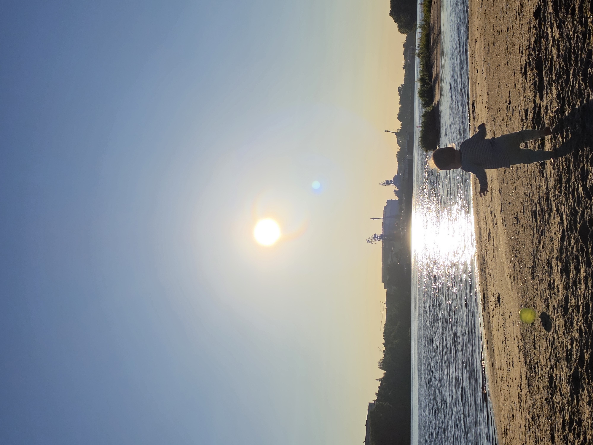 Summer evening on the Volga: sunset, sand, and a campfire.