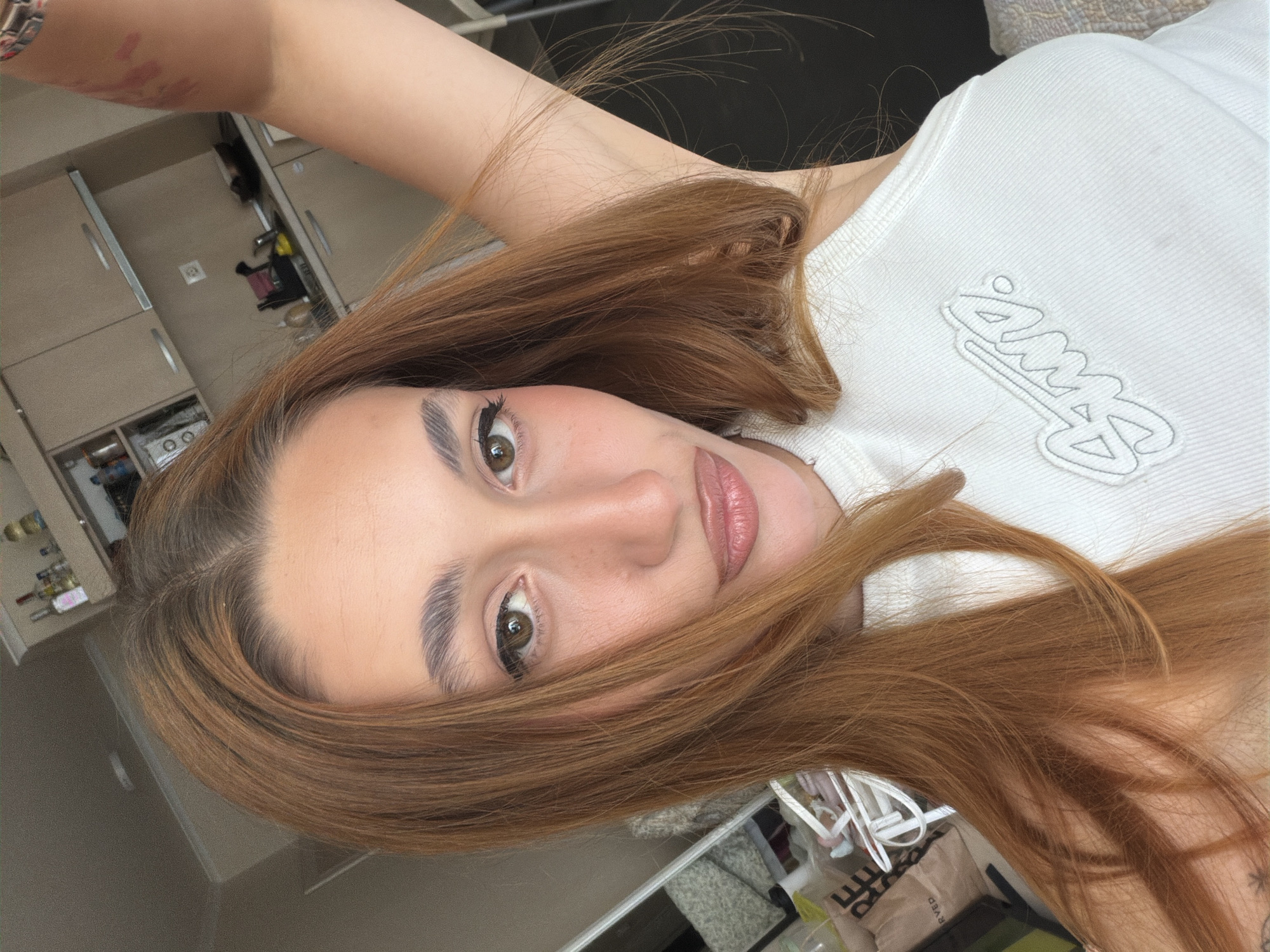 Woman takes multiple selfies across indoor locations in Sofia
