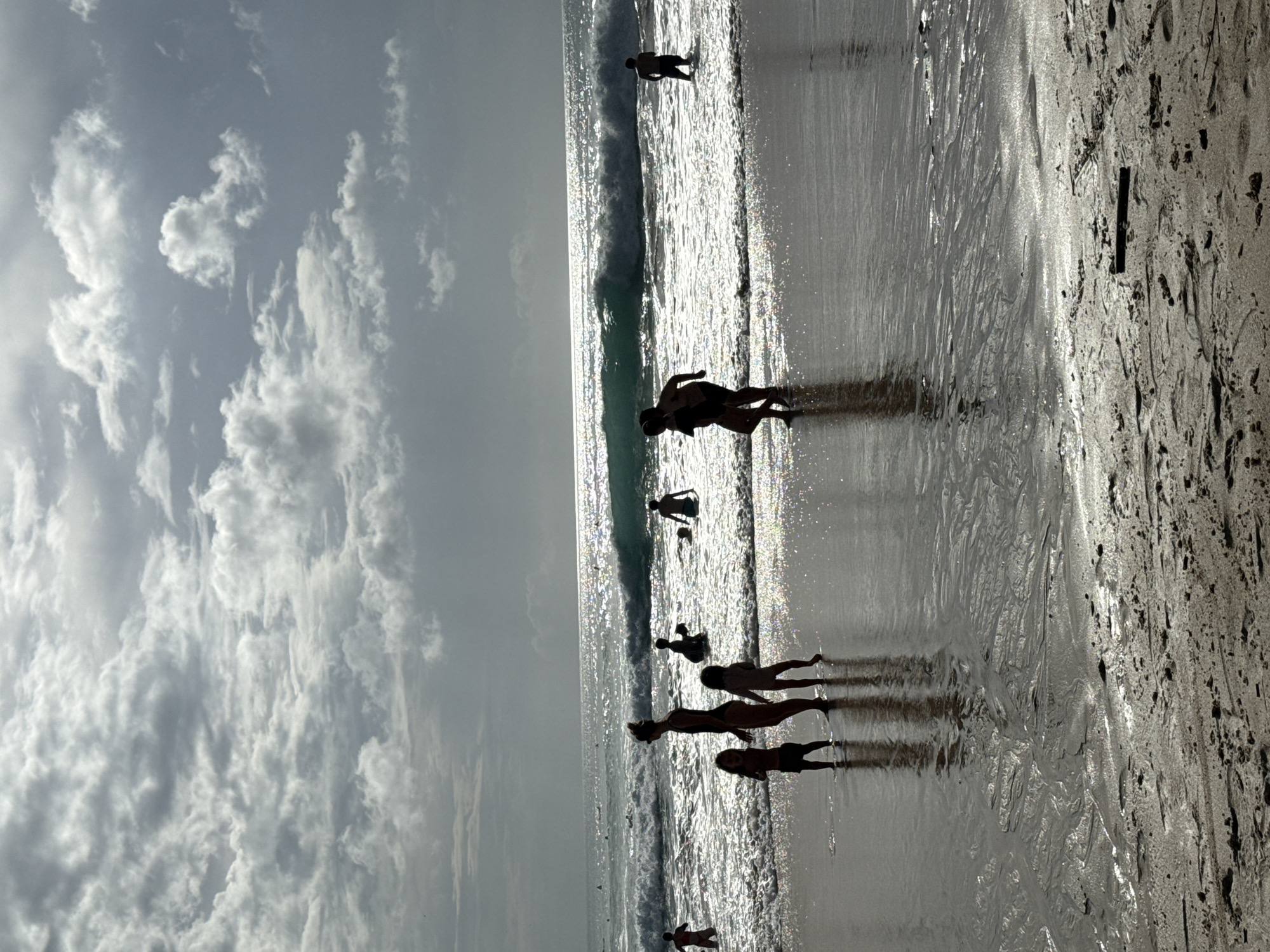 Woman and child enjoy morning beach time in Kuta