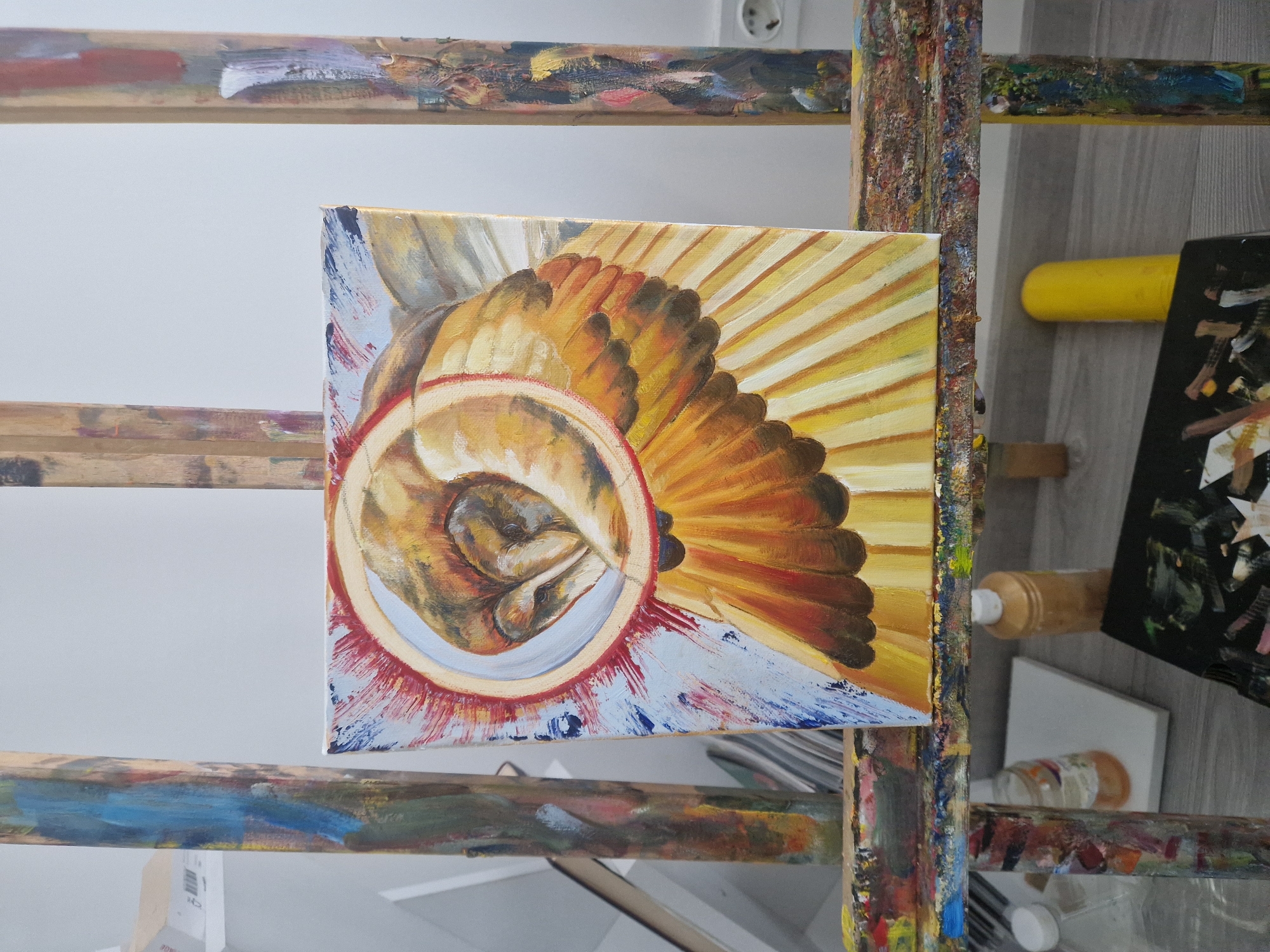 Art studio workspace documented with paint-splattered easel