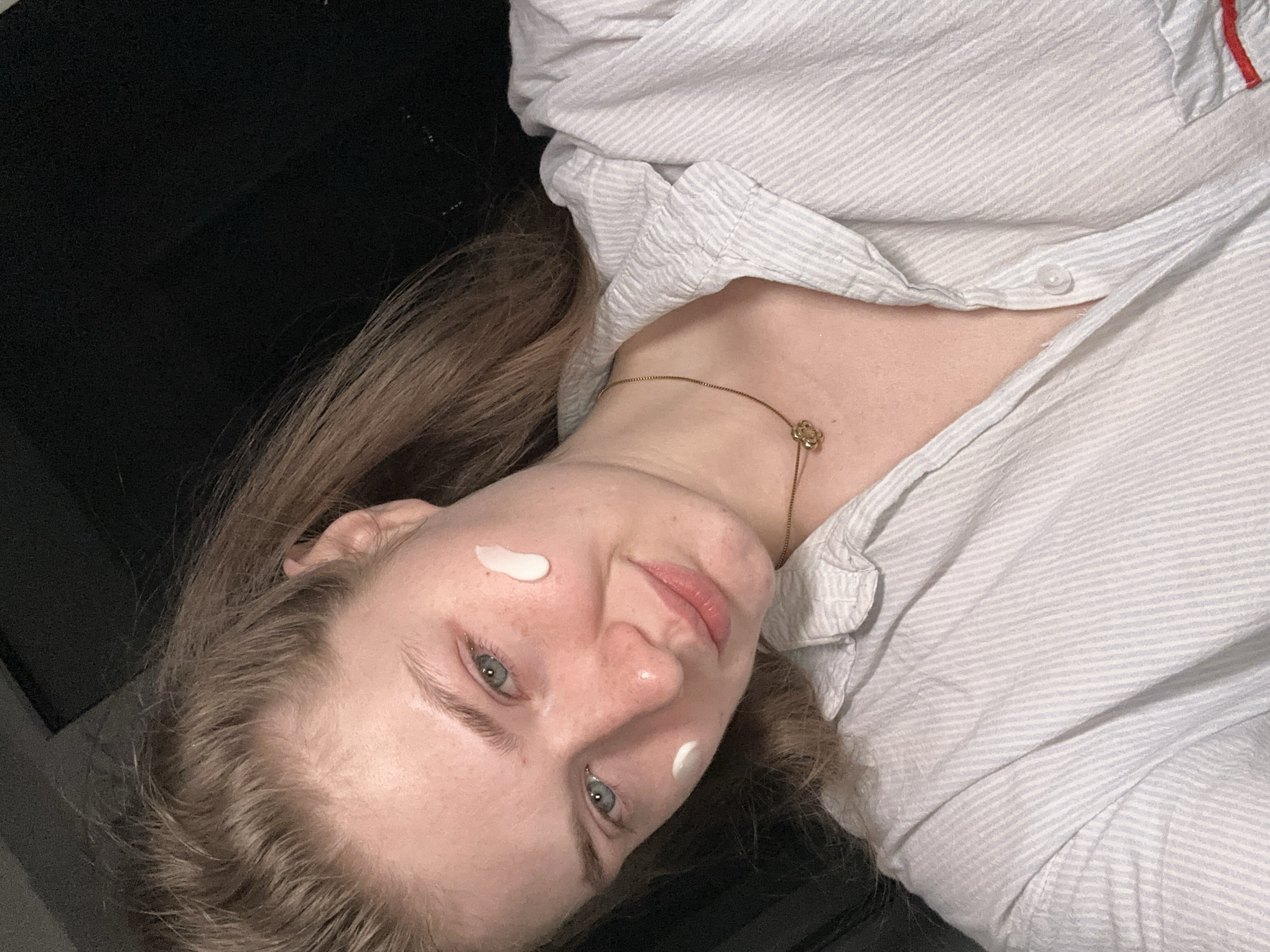 Woman takes selfie in pajamas at home in Kazan