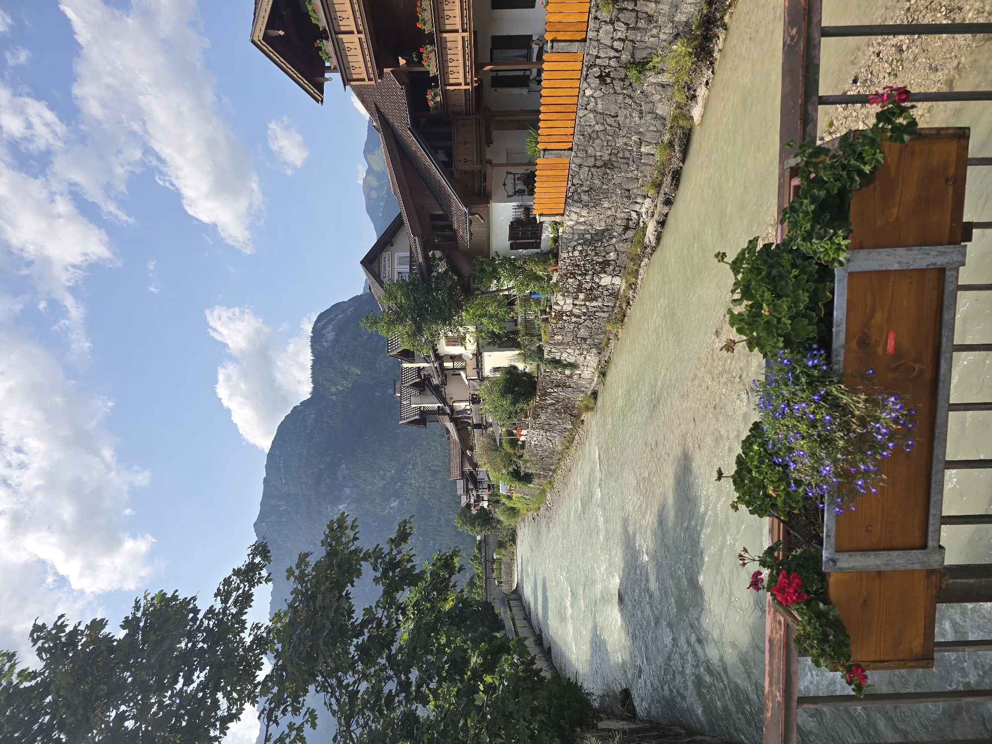 Loisach River and flower-lined streets of Garmisch-Partenkirchen in summer