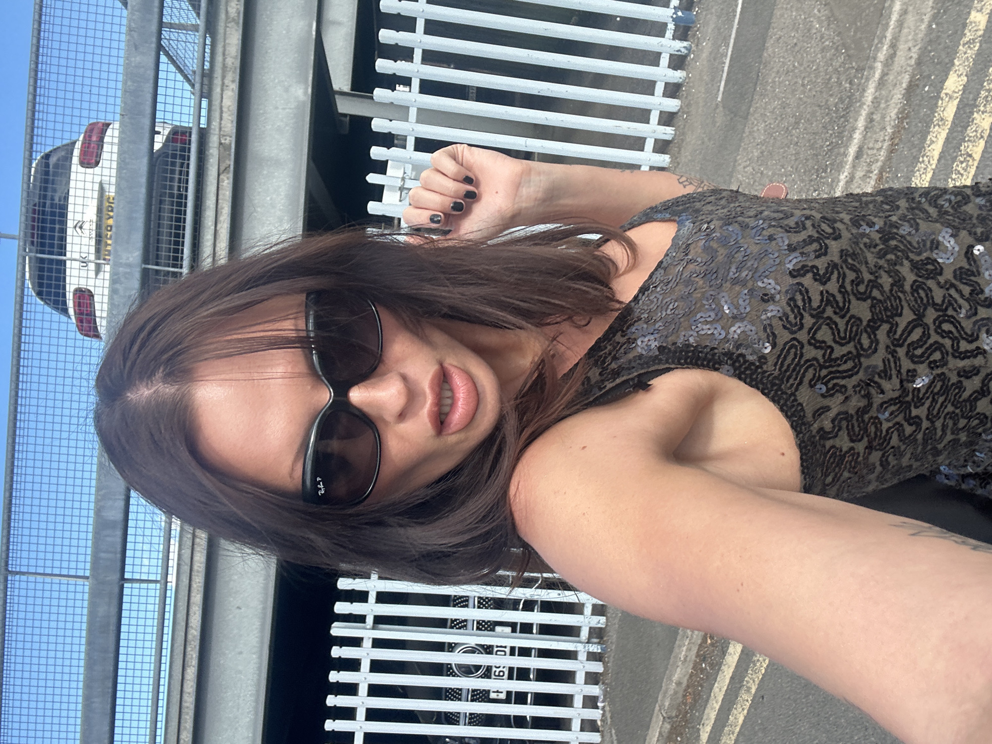 Selfie session in a Tonbridge parking lot, sequined top and shades