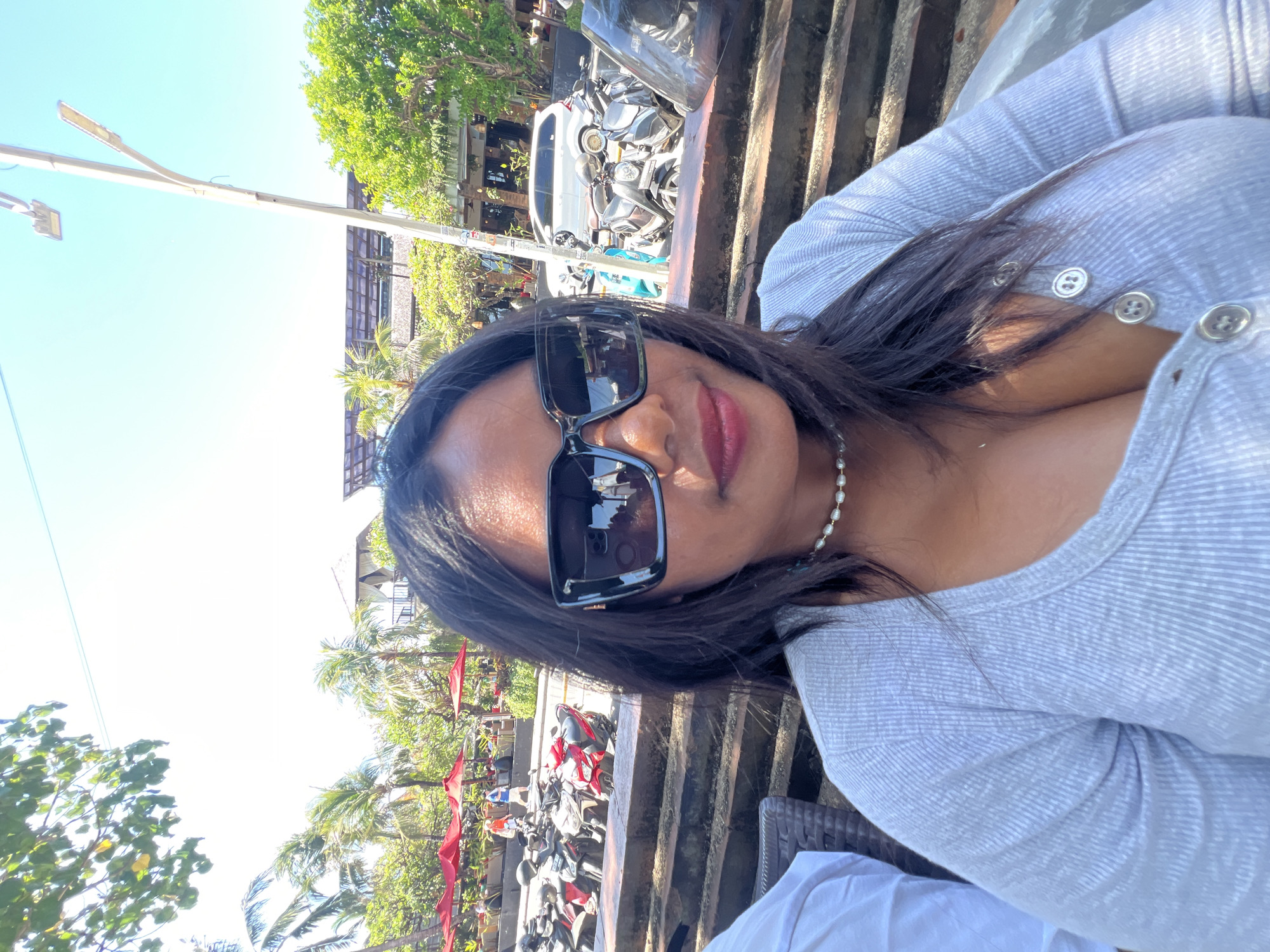 Casual outdoor moment in Kuta with tropical backdrop