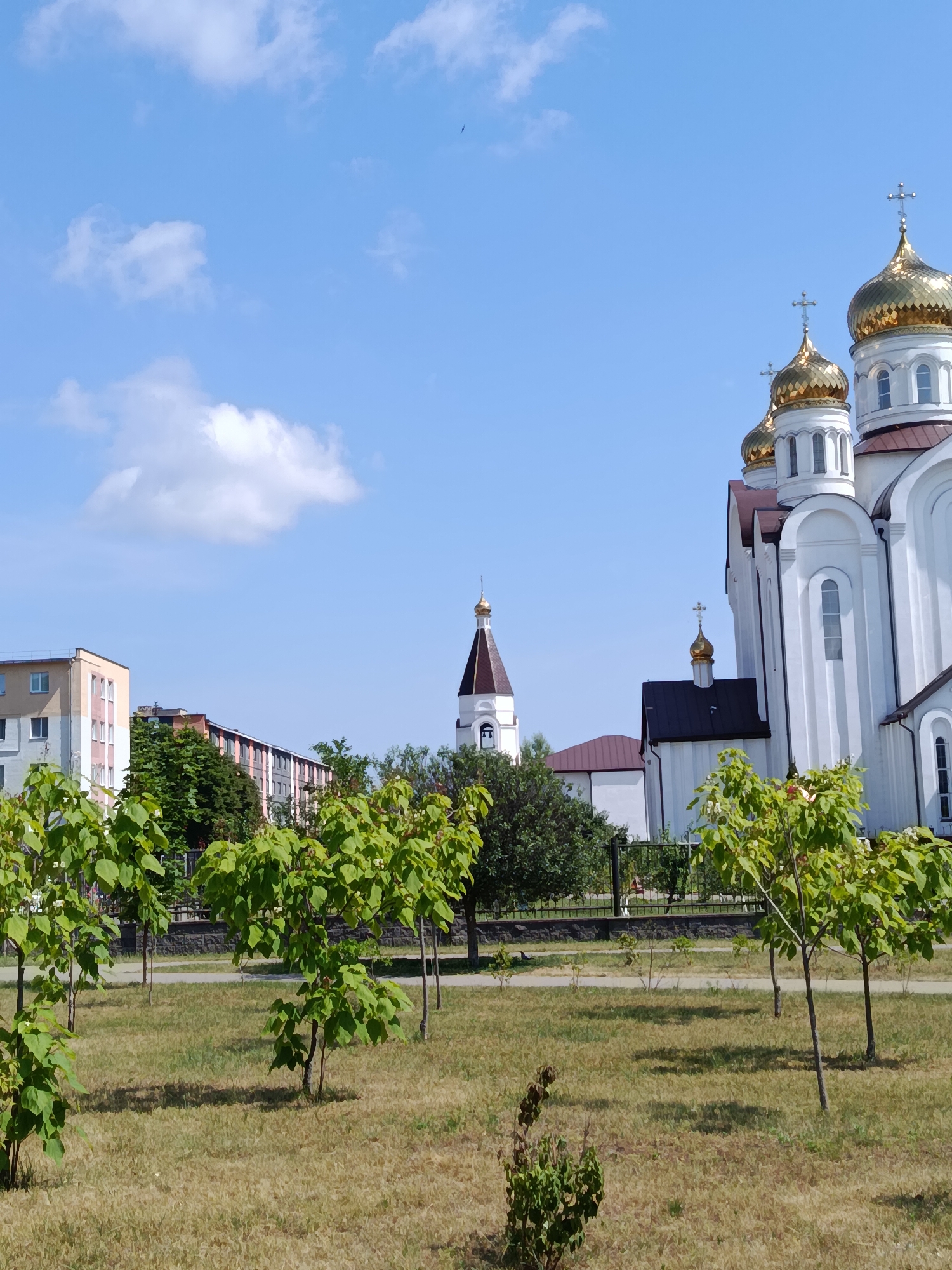 Gold-domed Orthodox cathedral on a sunny morning in Svietlahorsk