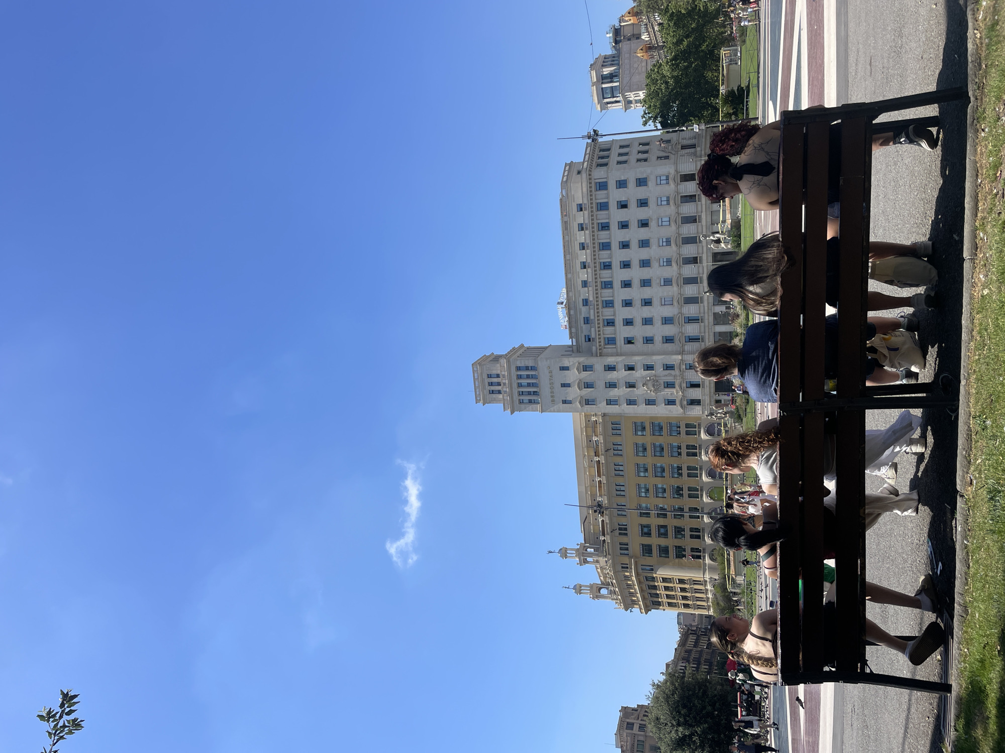 Pigeon feeding frenzy in a sunny Barcelona plaza