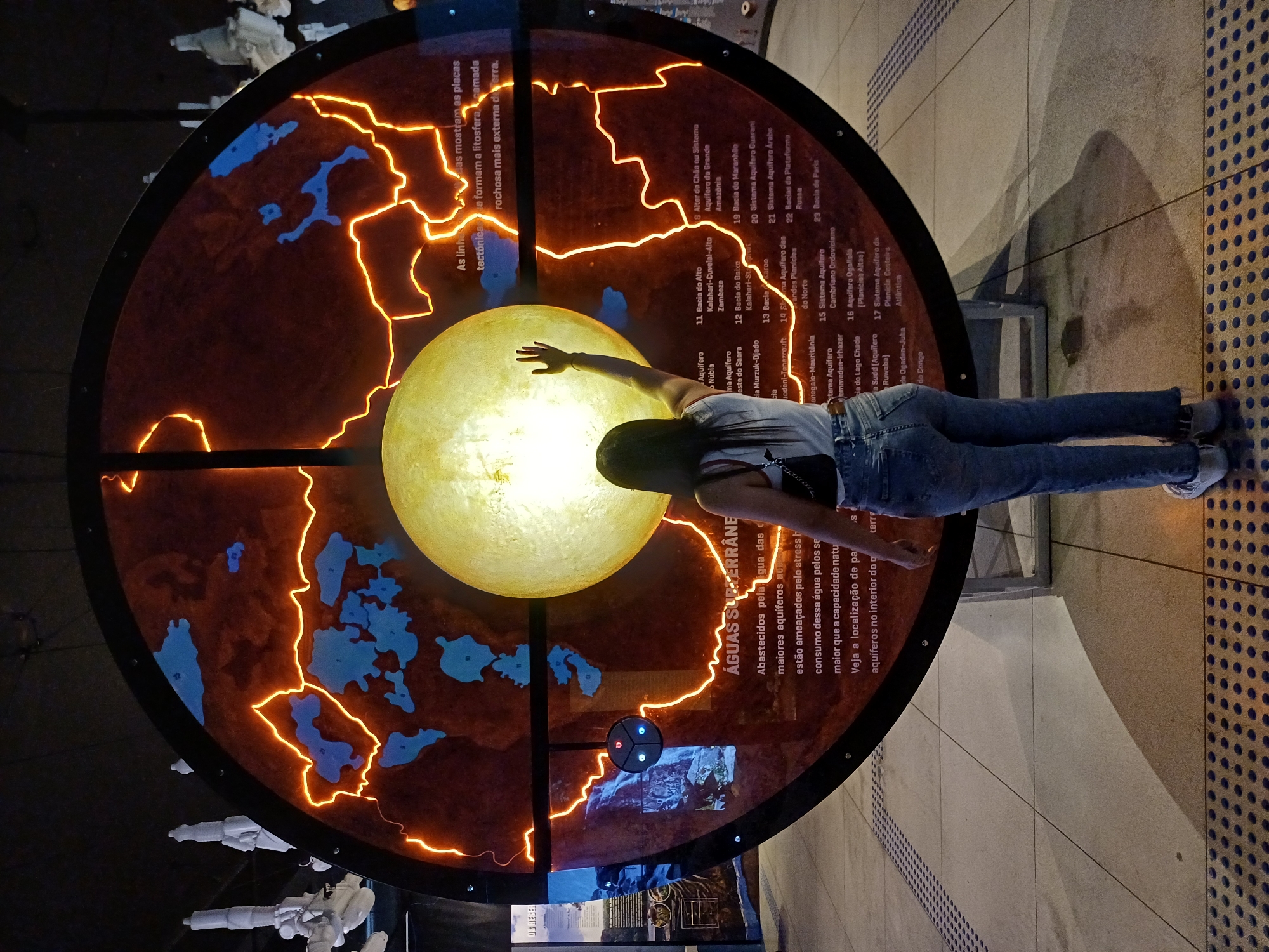 Science museum visitor documents water and earth exhibits in Curitiba