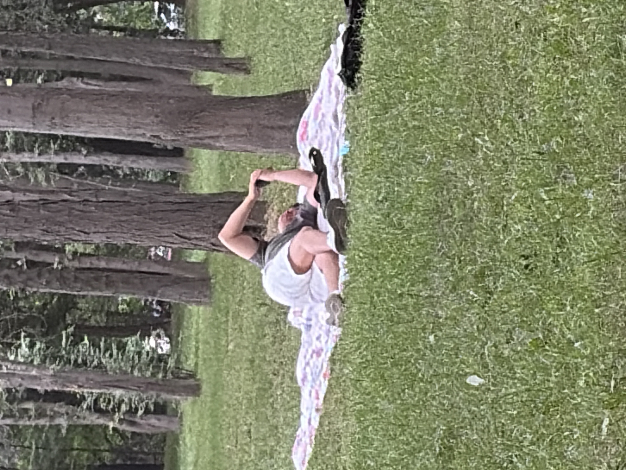 Weekend park gathering features families picnicking, playing, relaxing