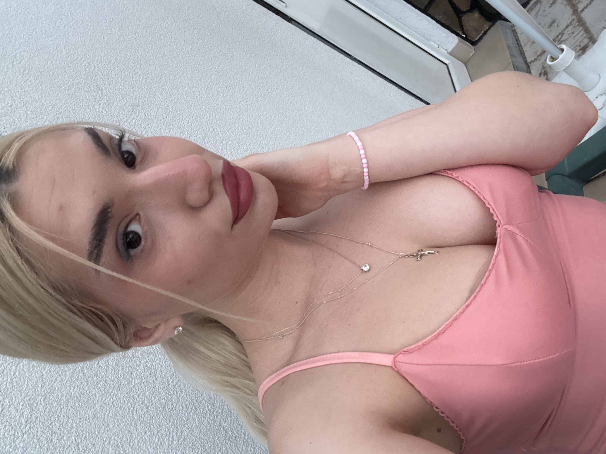 Blonde woman in pink top photographed in Skrat, Bulgaria