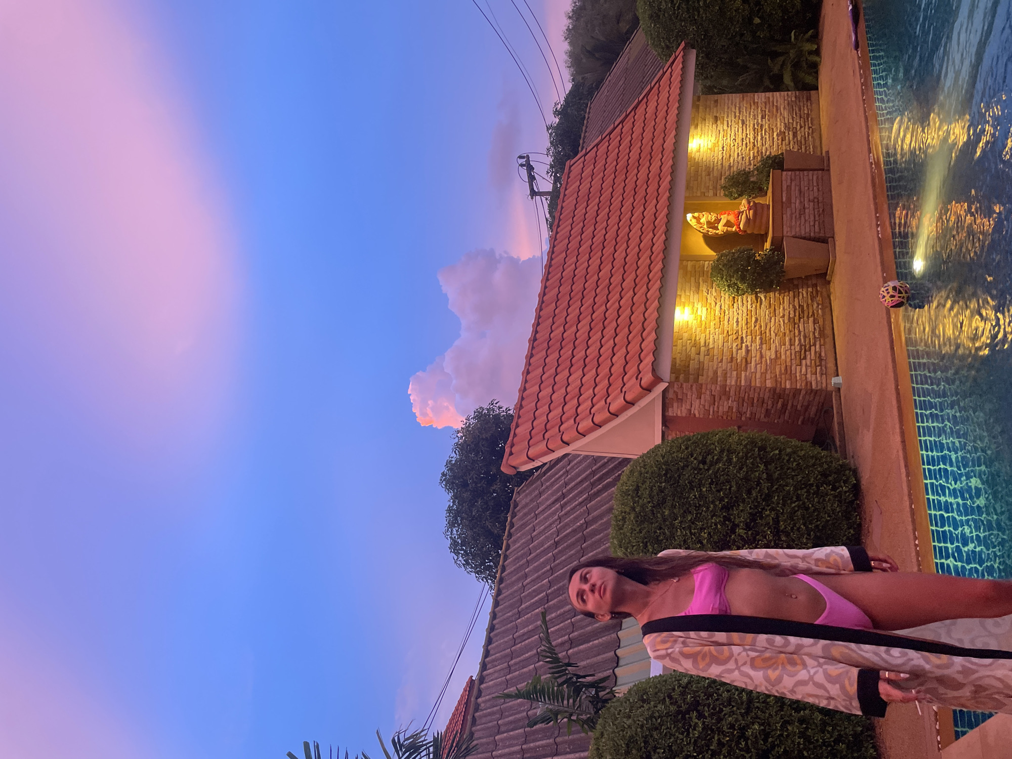 Rawai villa at dusk: poolside scenes and Hindu-Buddhist statuary