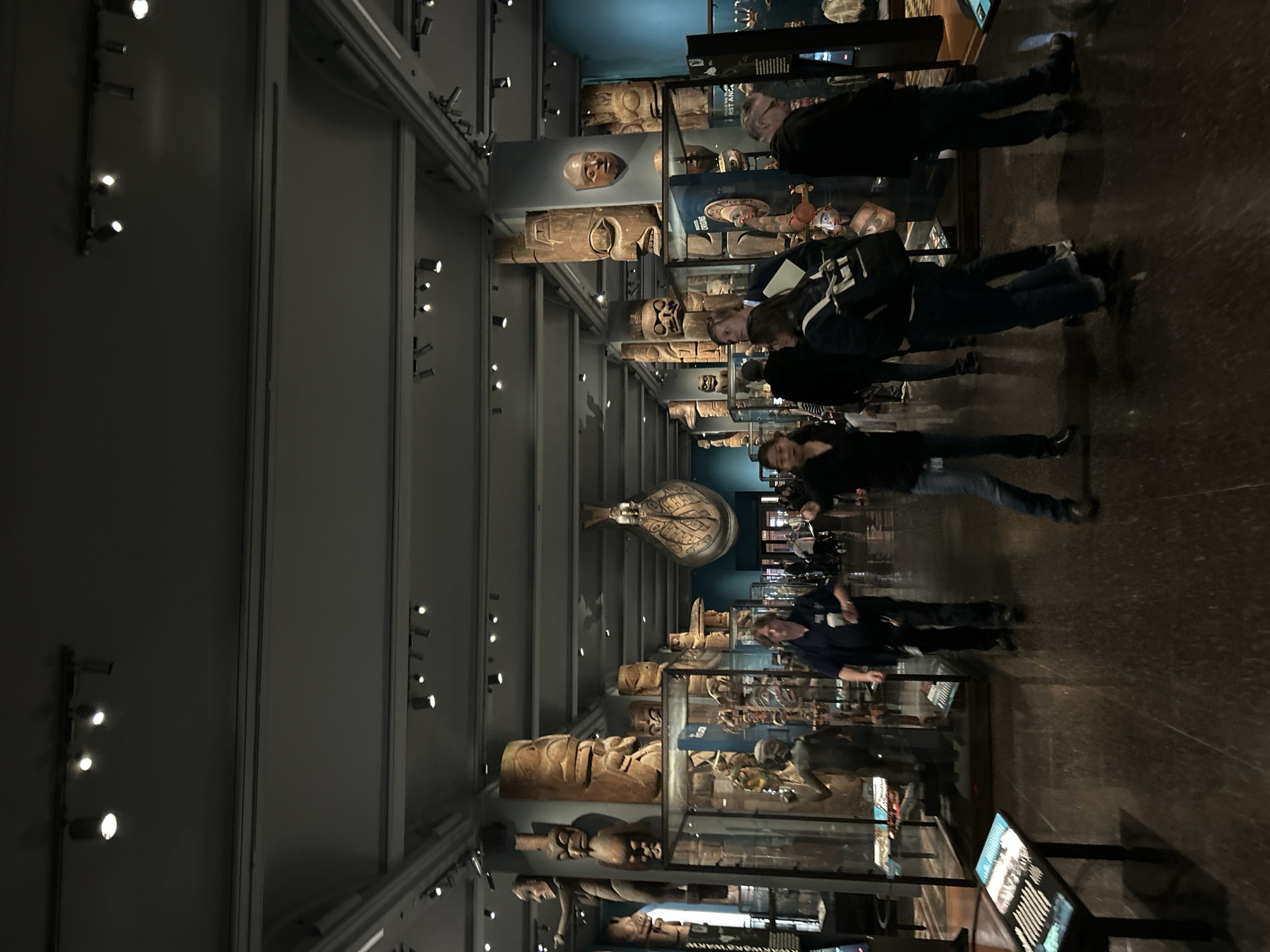 Museum visitors view indigenous totem pole exhibit in NYC
