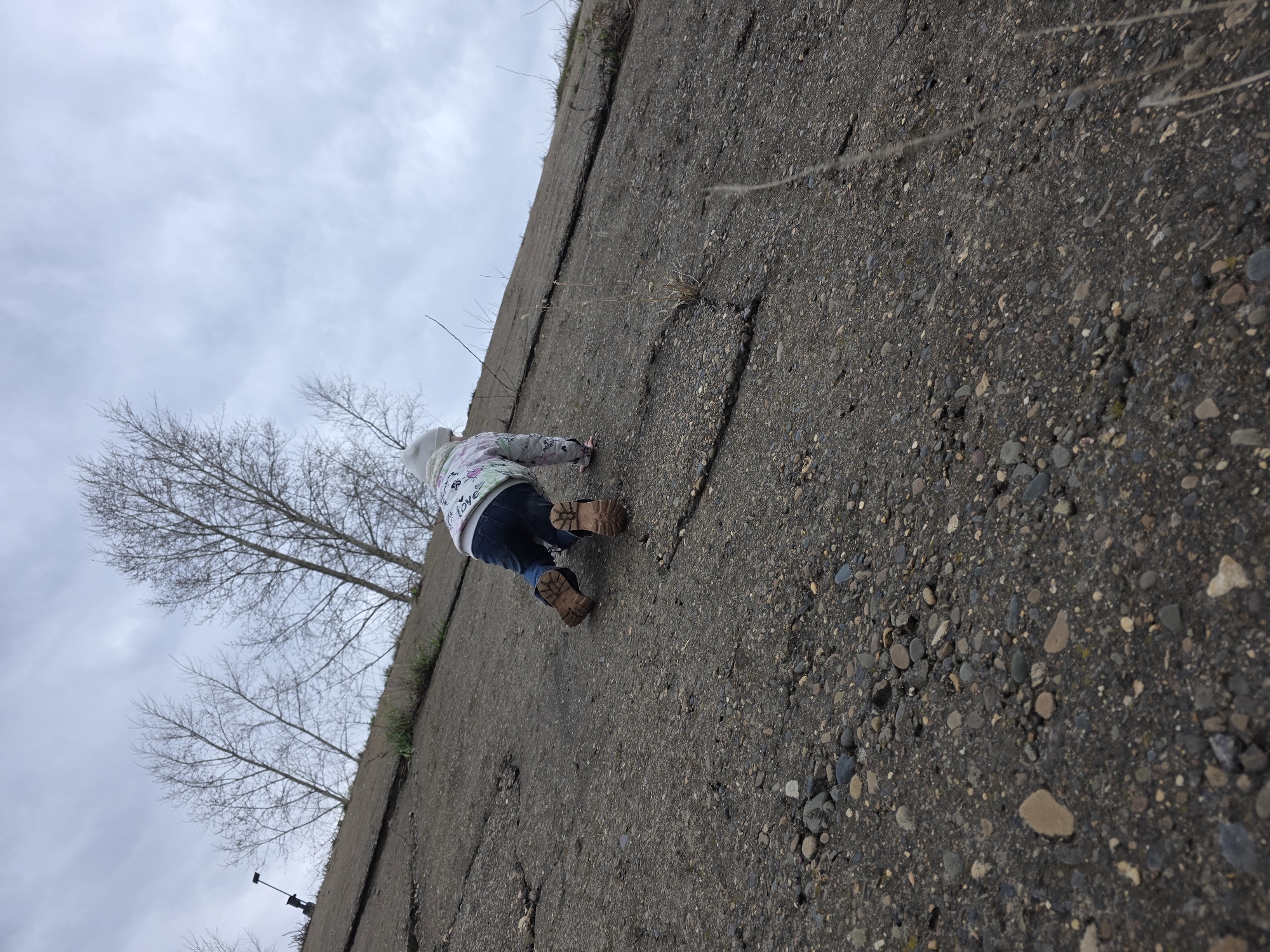 Mother and child visit riverside in Chaikovsky, Russia